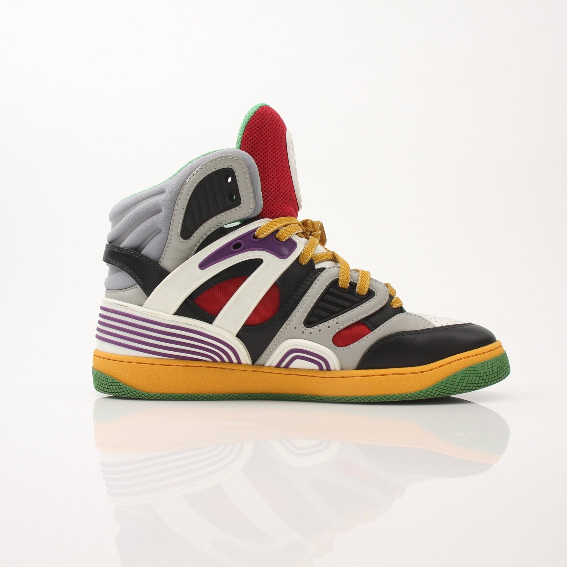 Gold & Beyond Gucci men's basketball high top sneakers, stylish black shoes with white accents and branded logo details.