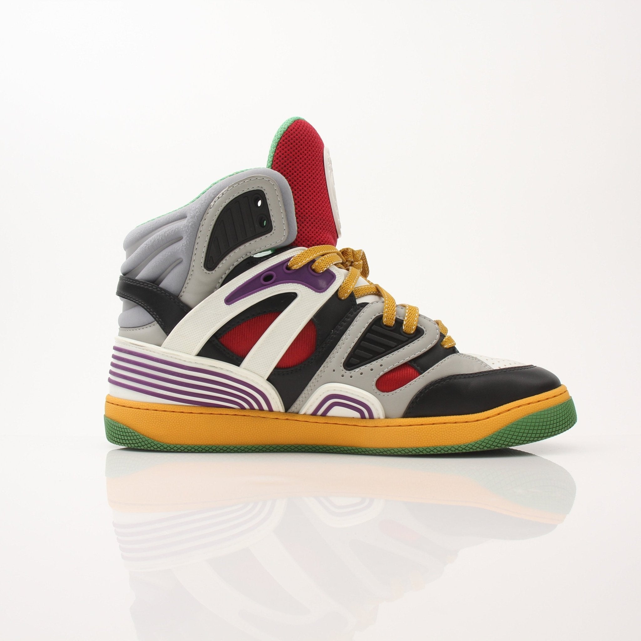 Gold & Beyond Gucci men's basketball high top sneakers, stylish black shoes with white accents and branded logo details.