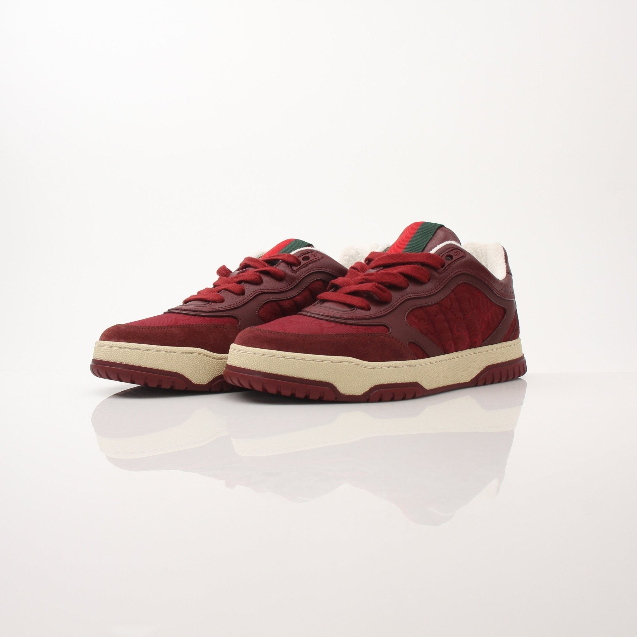 Gucci Men’s Re-Web Sneakers by Gold & Beyond, stylish sports shoes with signature web detail and white sole, on plain background.