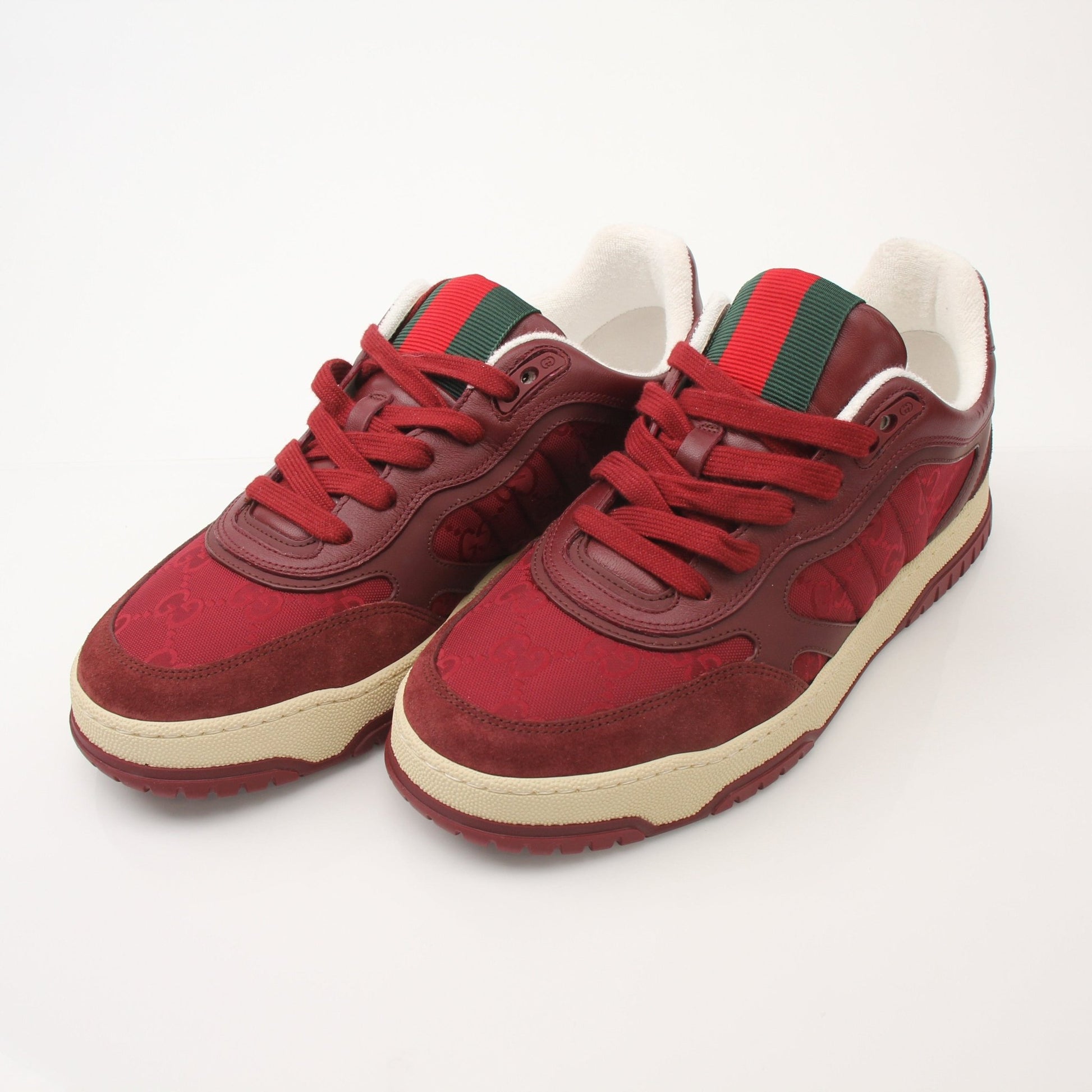 Gucci Men’s Re-Web sneakers by Gold & Beyond, stylish shoes with iconic web stripe design, white and green accents, side view.