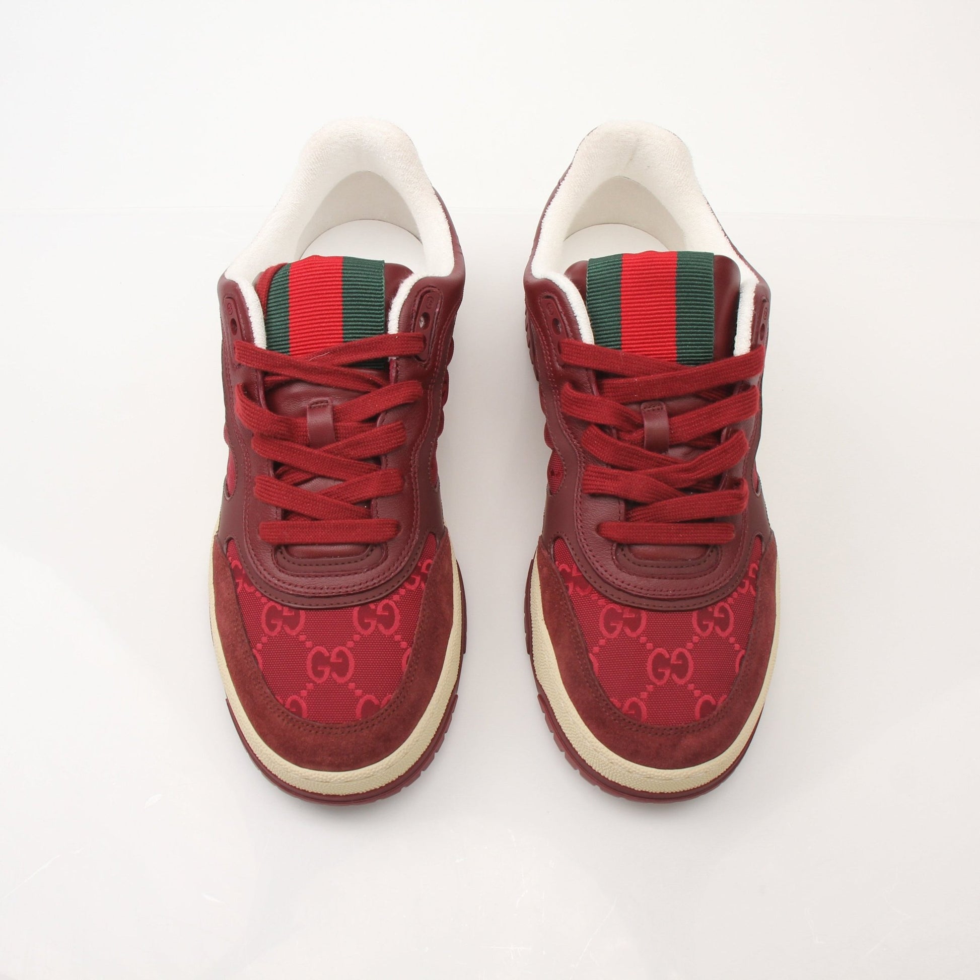 Gucci Men’s Re-Web Sneakers by Gold & Beyond showing stylish sneakers with iconic web stripe design and clean white soles.