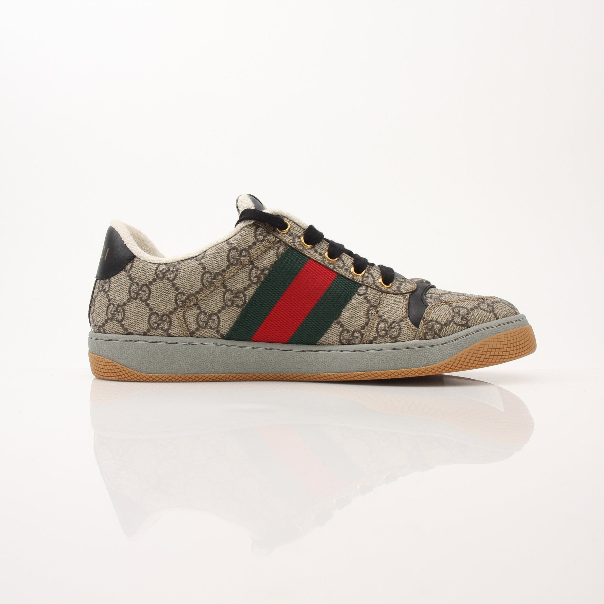 Gold & Beyond Gucci Men’s Screener GG Sneakers, black and white shoes with signature logo, lace-up design, and sporty style.