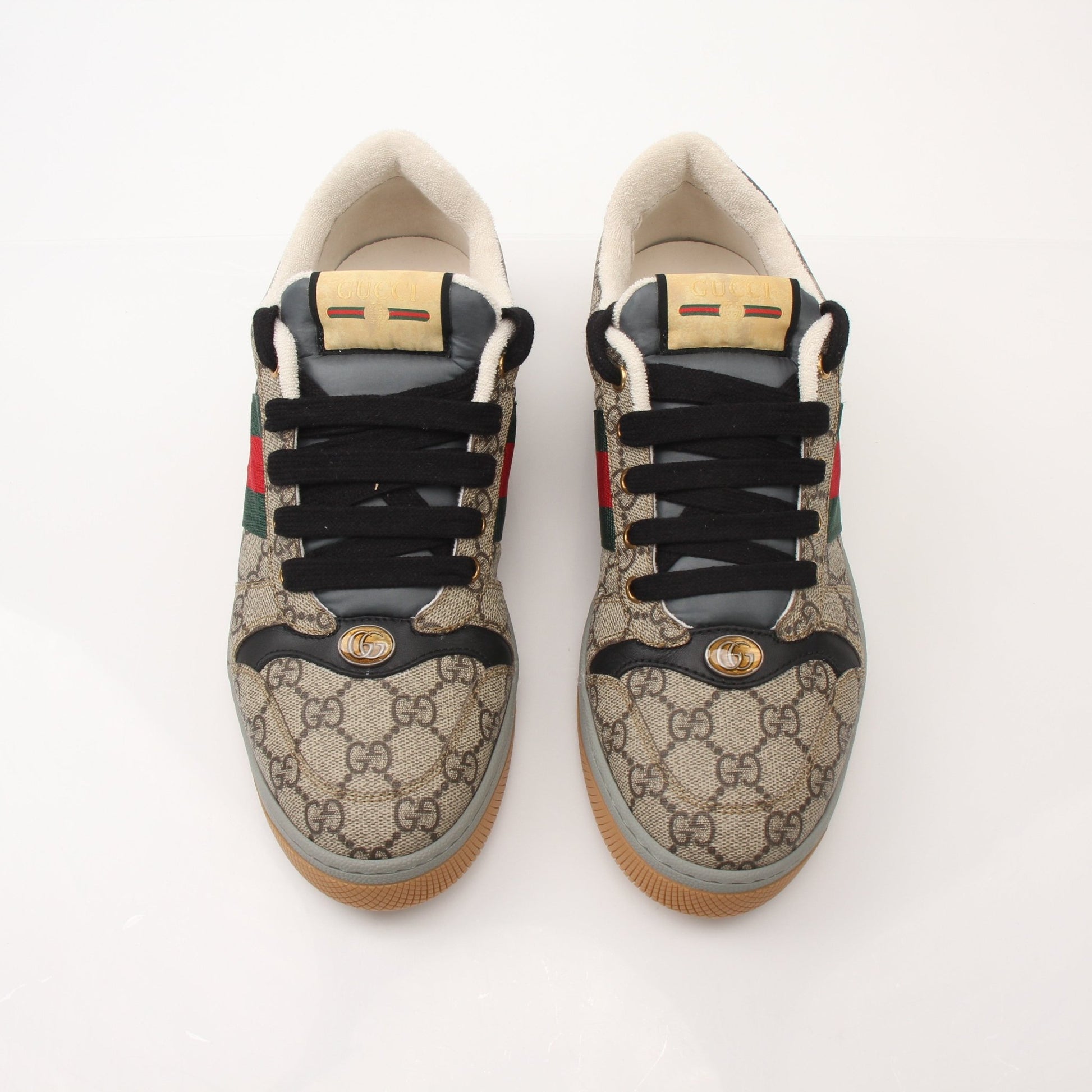 Gold & Beyond Gucci Men’s Screener GG Sneakers, stylish shoes with iconic GG pattern and modern design, shown in this image.