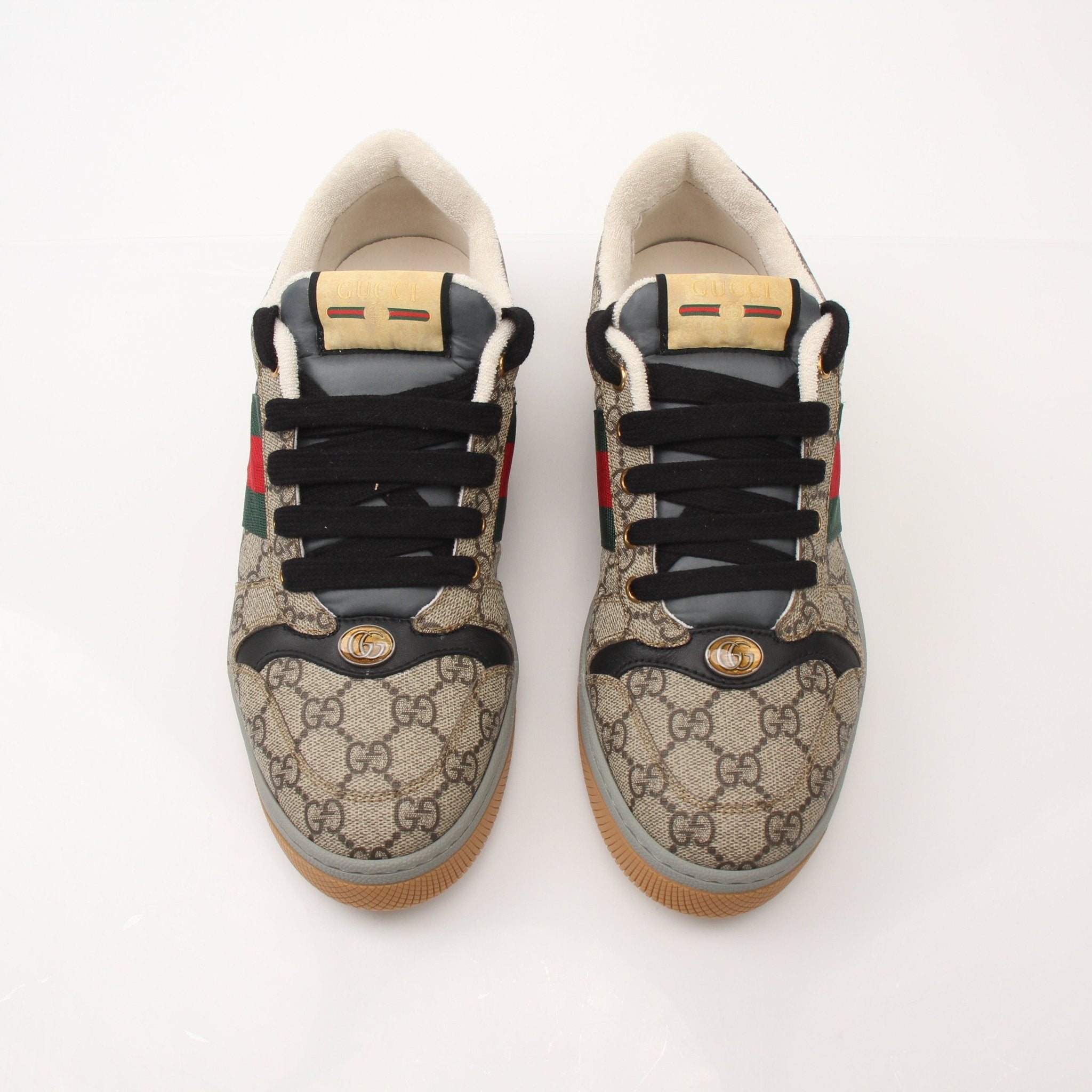 Gold & Beyond Gucci Men’s Screener GG Sneakers, stylish shoes with iconic GG pattern and modern design, shown in this image.
