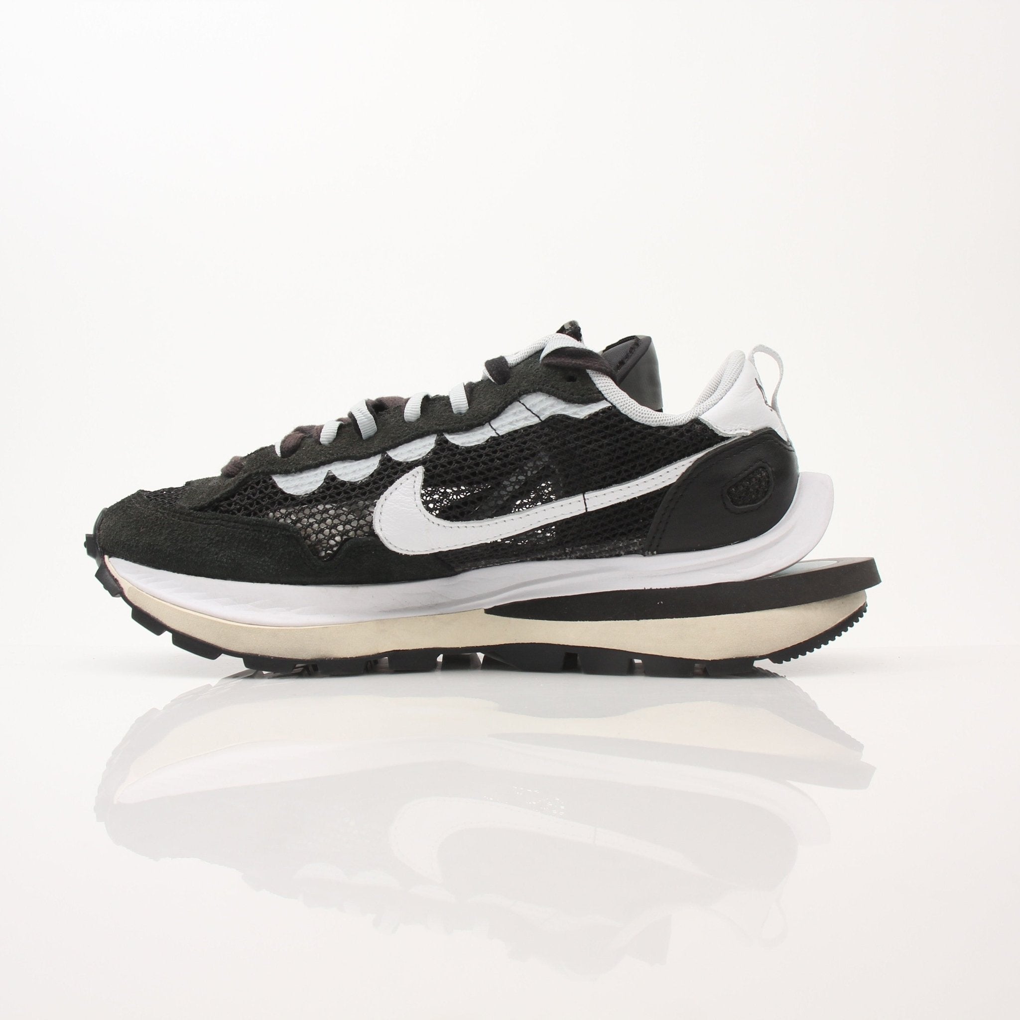 Nike x Sacai VaporWaffle sneakers for men, featuring mixed materials and layered design, displayed on a neutral background.