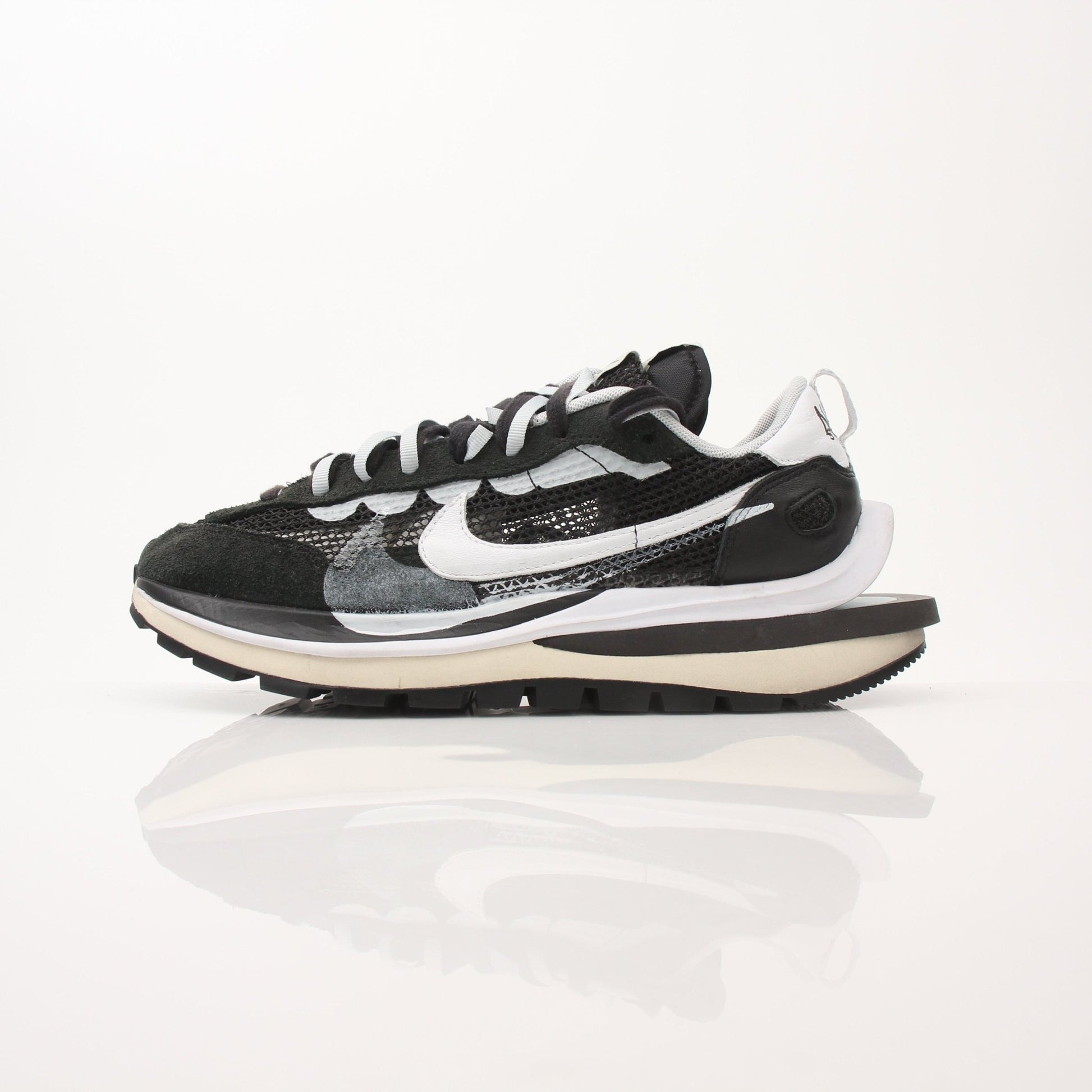 Nike x Sacai VaporWaffle sneakers for men, stylish shoes with layered design and athletic features, shown in the image.