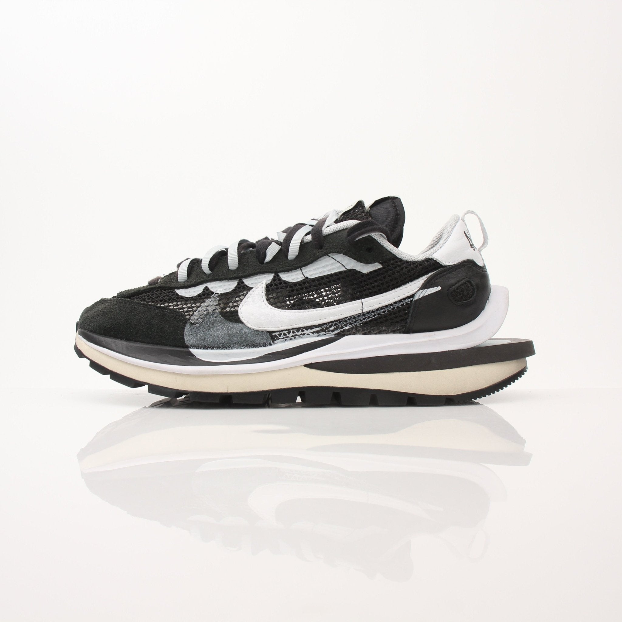 Nike x Sacai VaporWaffle sneakers for men, stylish shoes with layered design and athletic features, shown in the image.