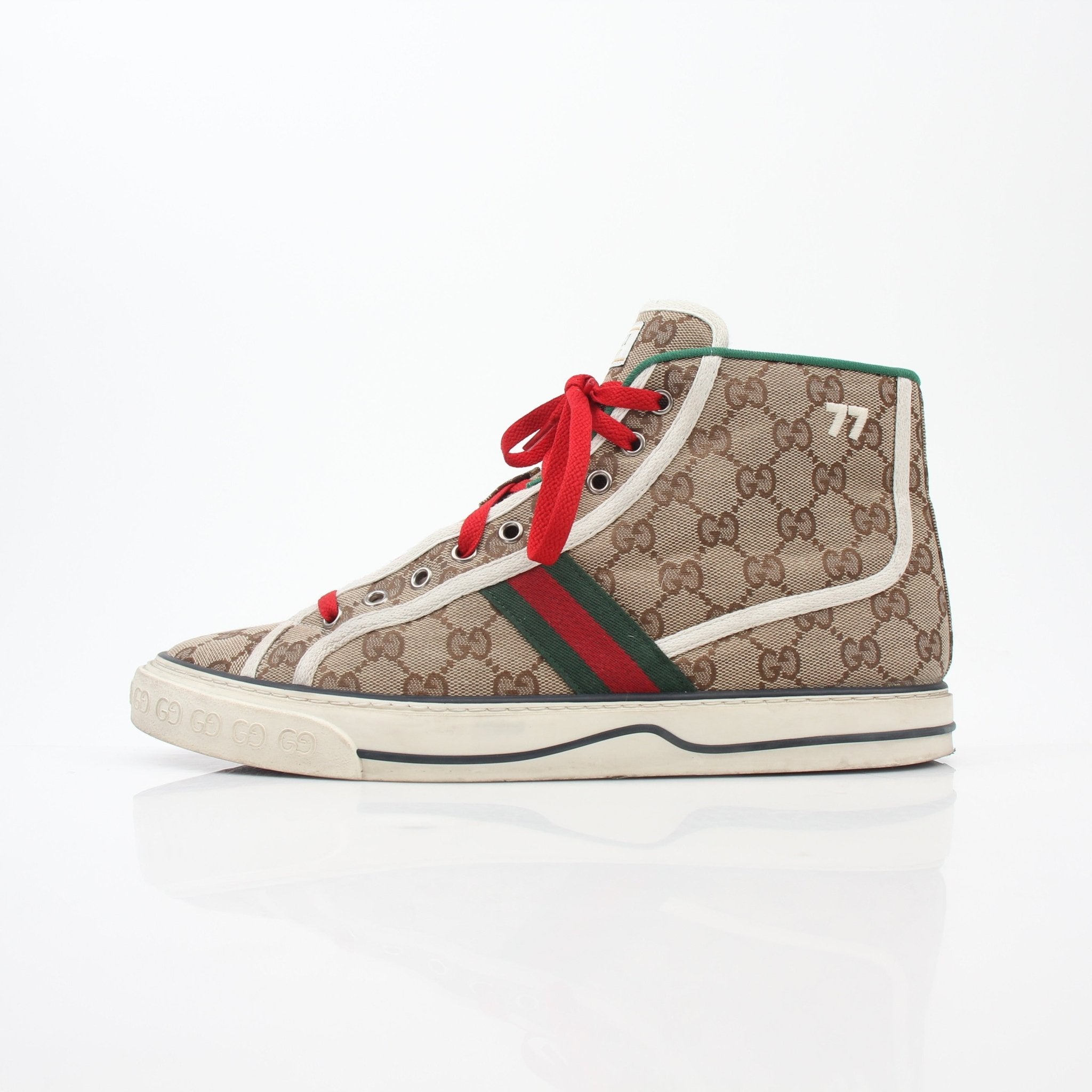Gold & Beyond Gucci Beige Tennis 1977 high-top sneakers with leather uppers and rubber soles, styled with casual laces.