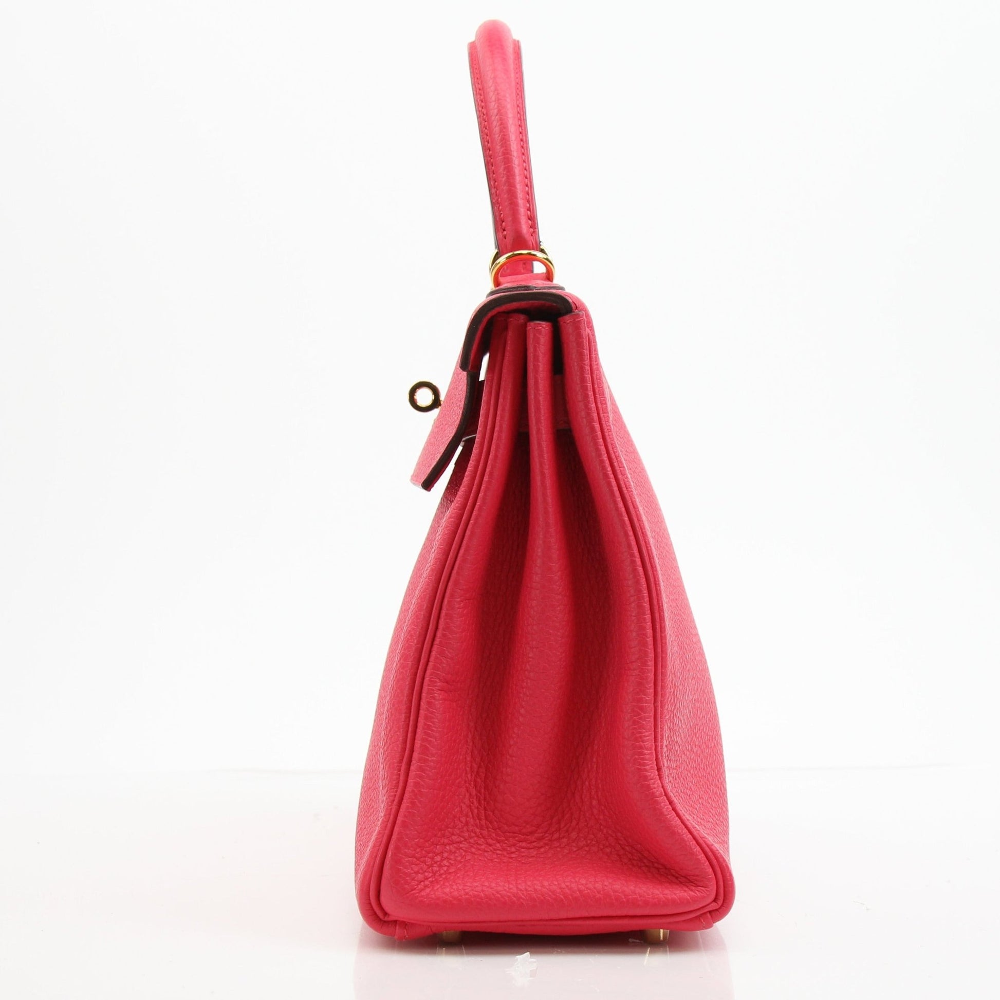 Hermès Kelly 28 Pink Togo handbag with gold hardware, showcasing the elegant design and luxurious leather texture.