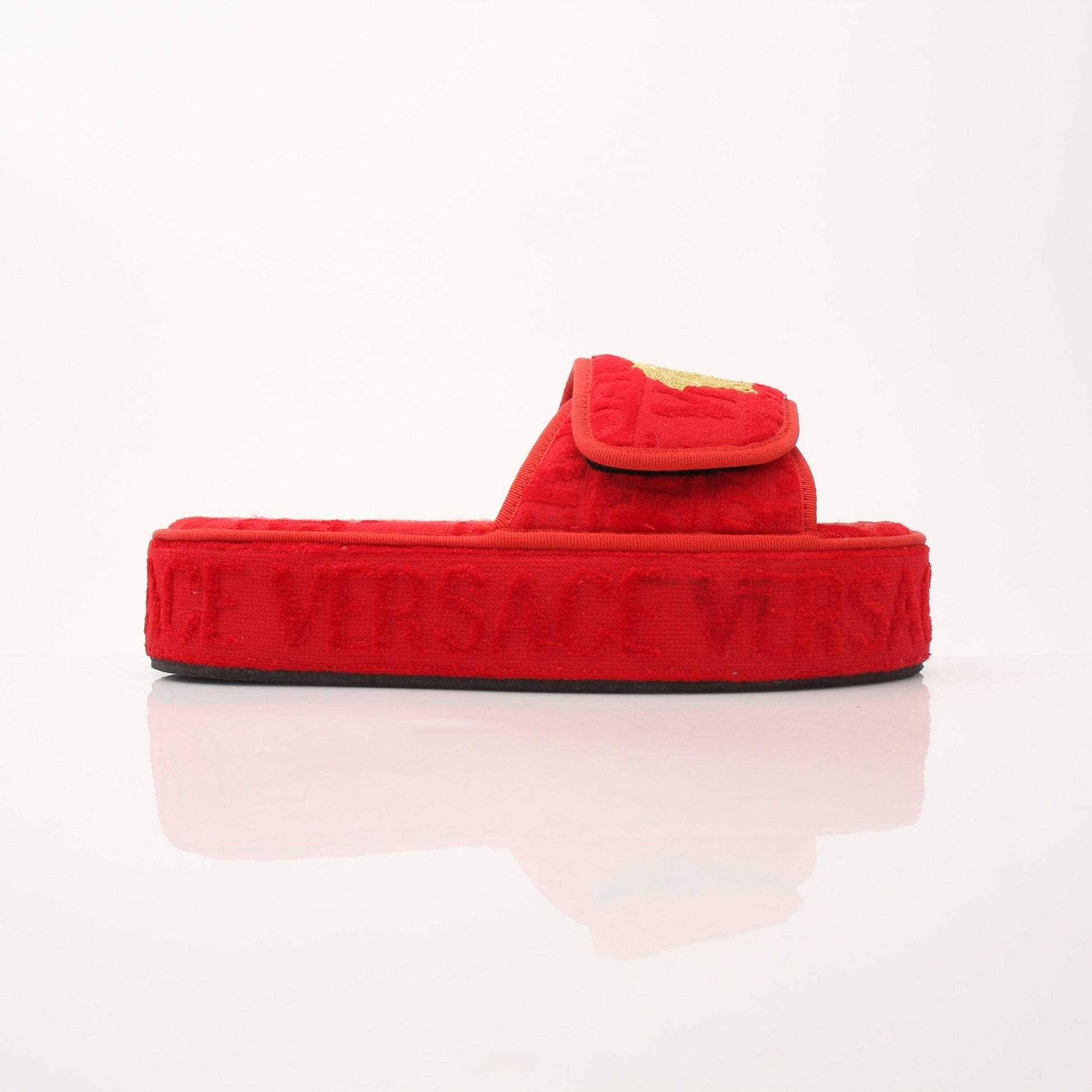 Gold & Beyond Versace women’s red all-over slippers, stylish slip-on shoes with iconic pattern and comfortable design.