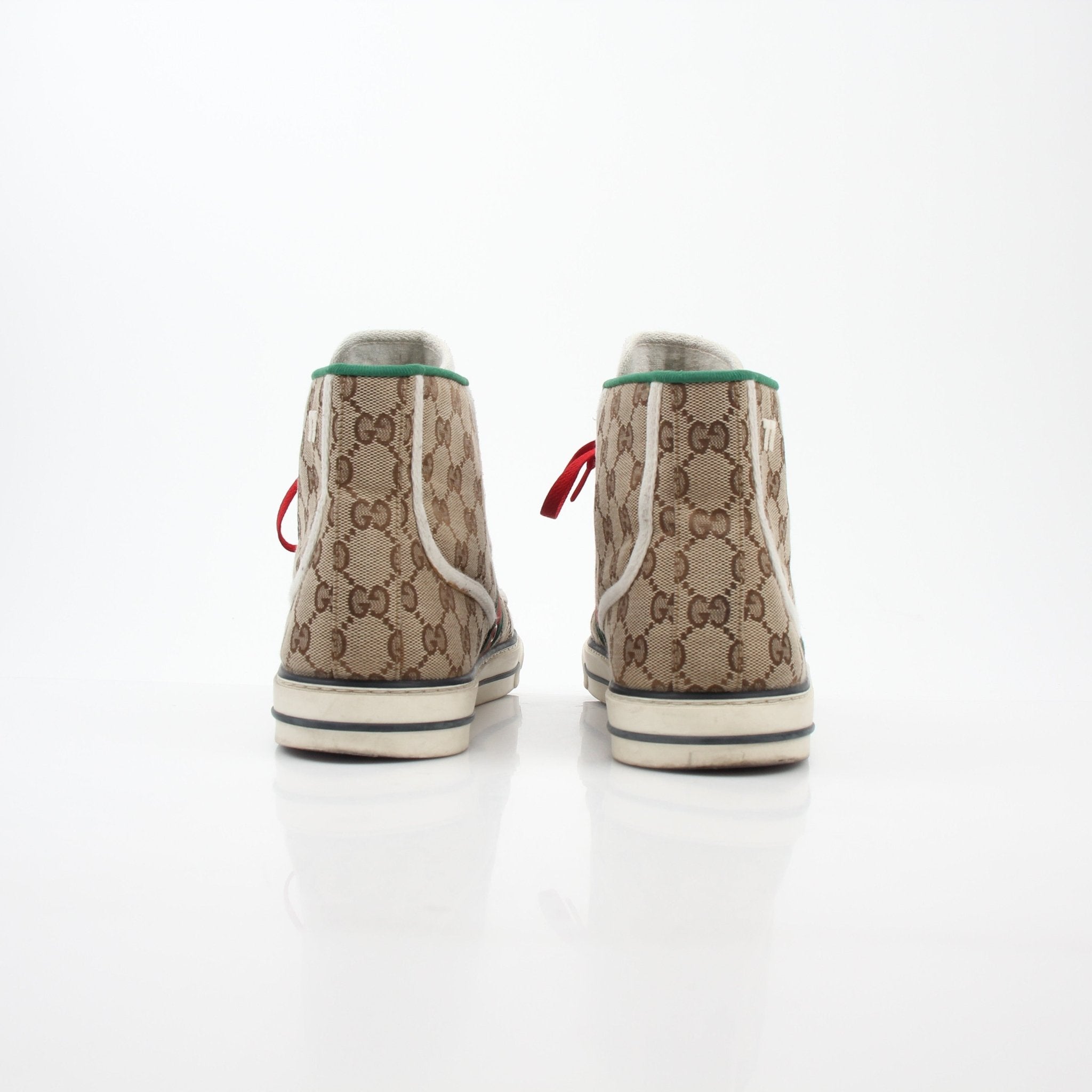 Gold & Beyond Gucci Beige Tennis 1977 high-top sneakers, showing beige canvas shoes with white laces and rubber soles.