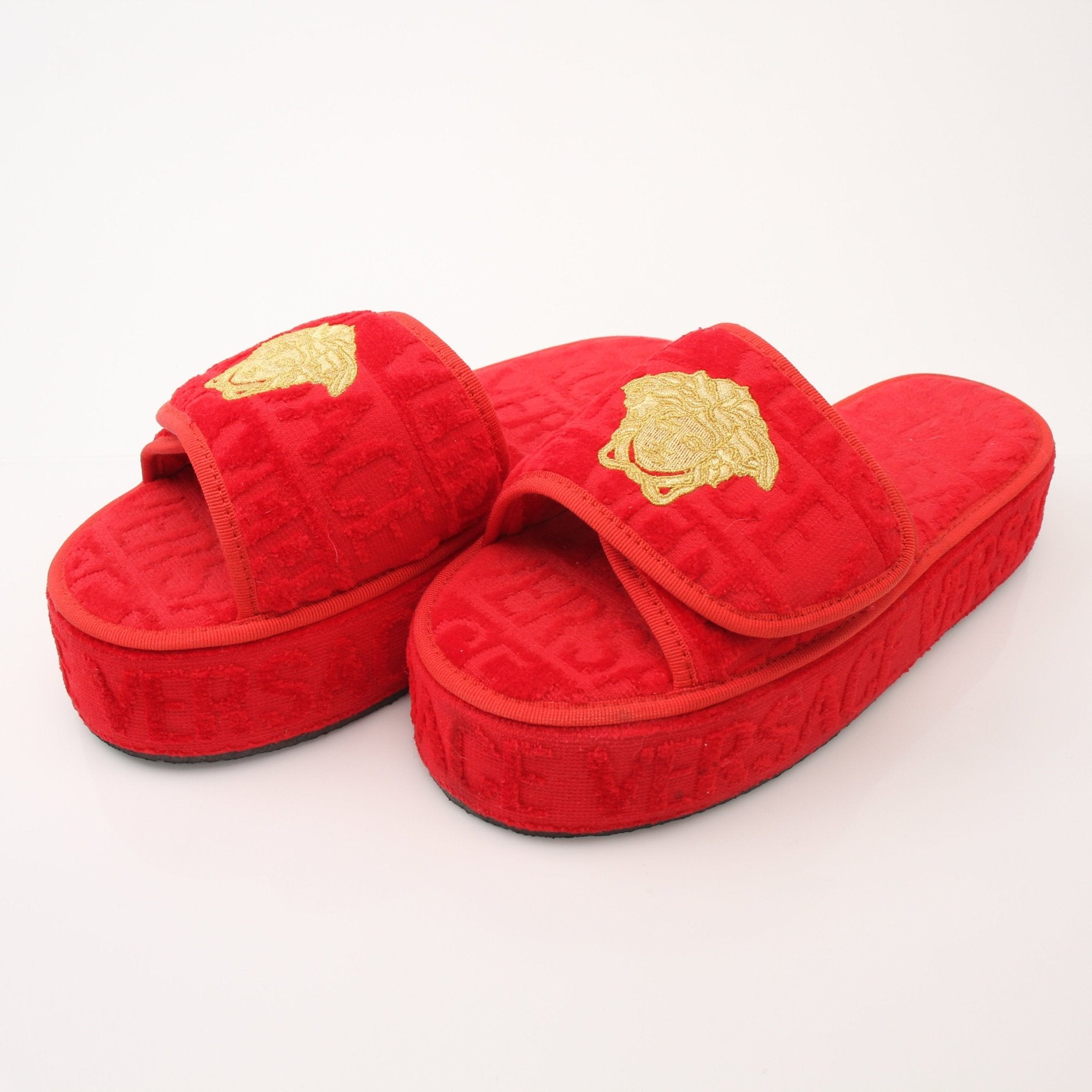 Red Versace women's slippers with all-over pattern, stylish shoes from Gold & Beyond, featuring a luxurious and comfortable design.