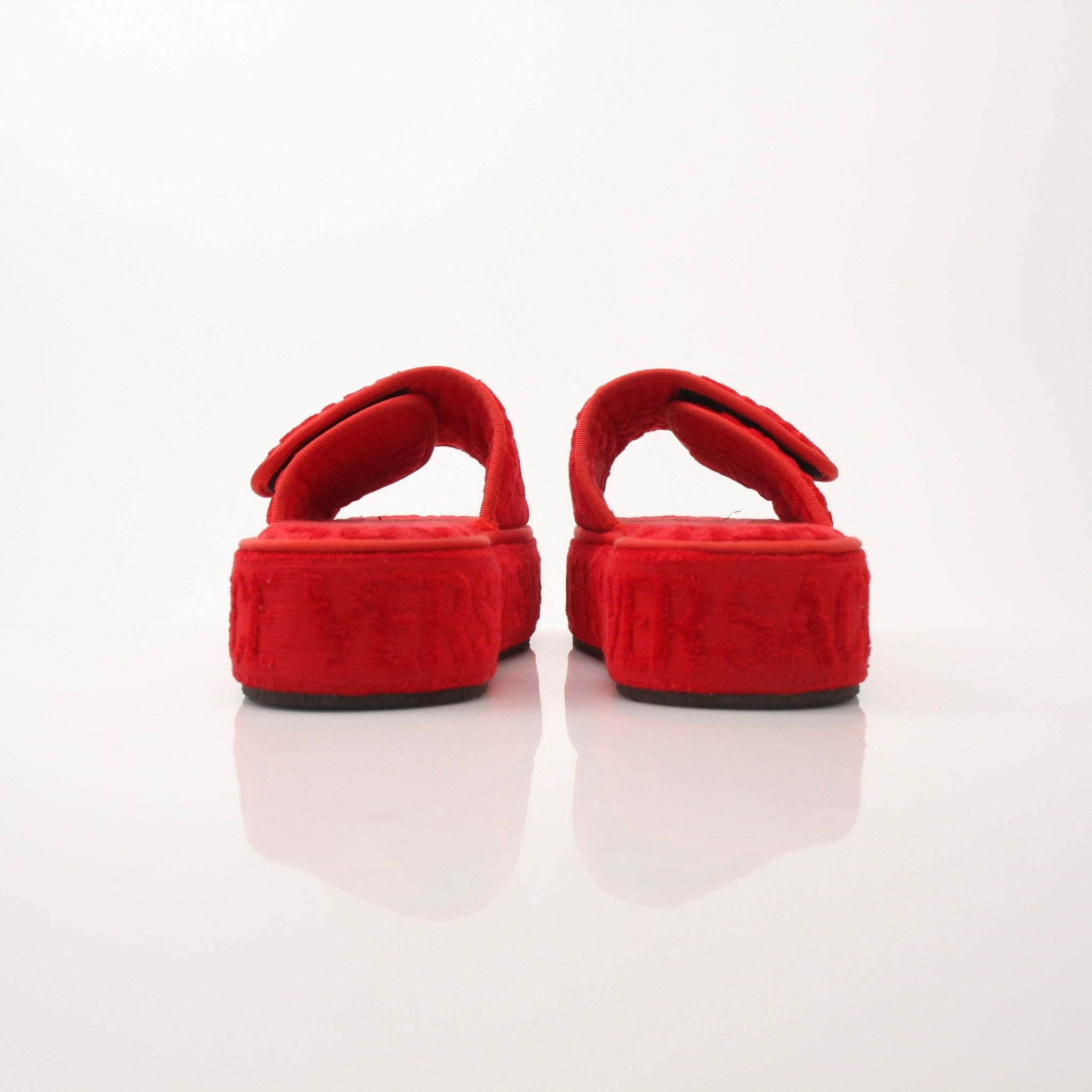 Red Versace women's slippers with all-over pattern, showcasing comfortable slip-on shoes from Gold & Beyond.