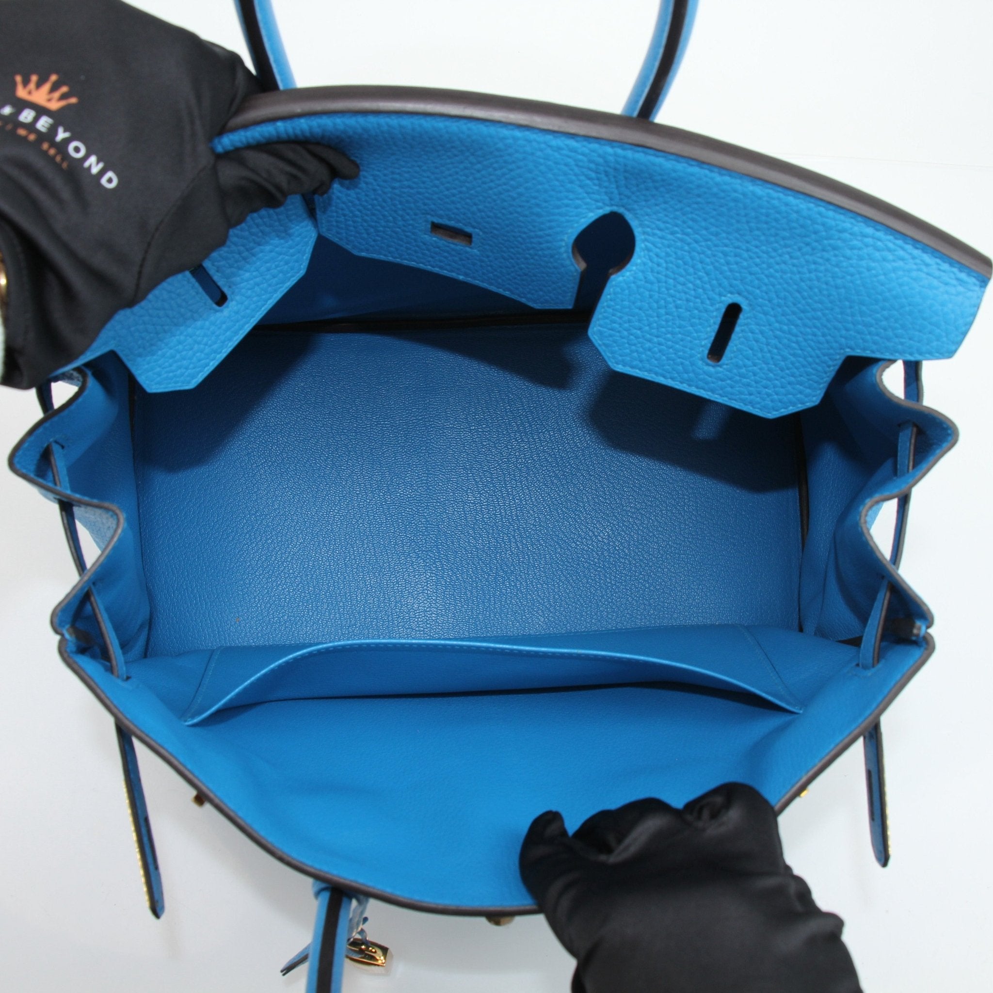 Hermès Birkin 35 Clemence handbag with gold hardware, showcasing luxurious leather and elegant design.