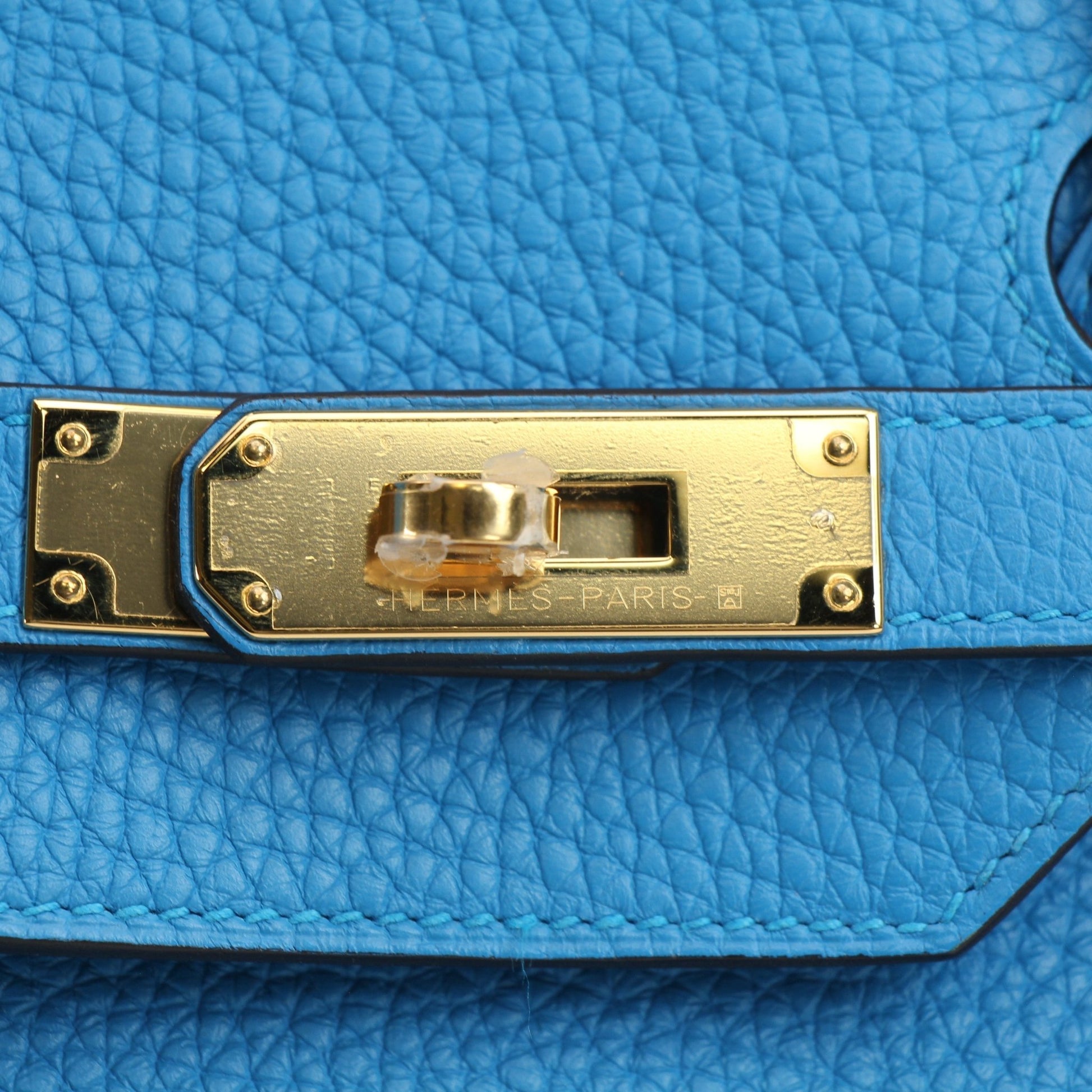 Hermès Birkin 35 Clemence handbag with gold hardware, showcasing luxurious leather and classic design.