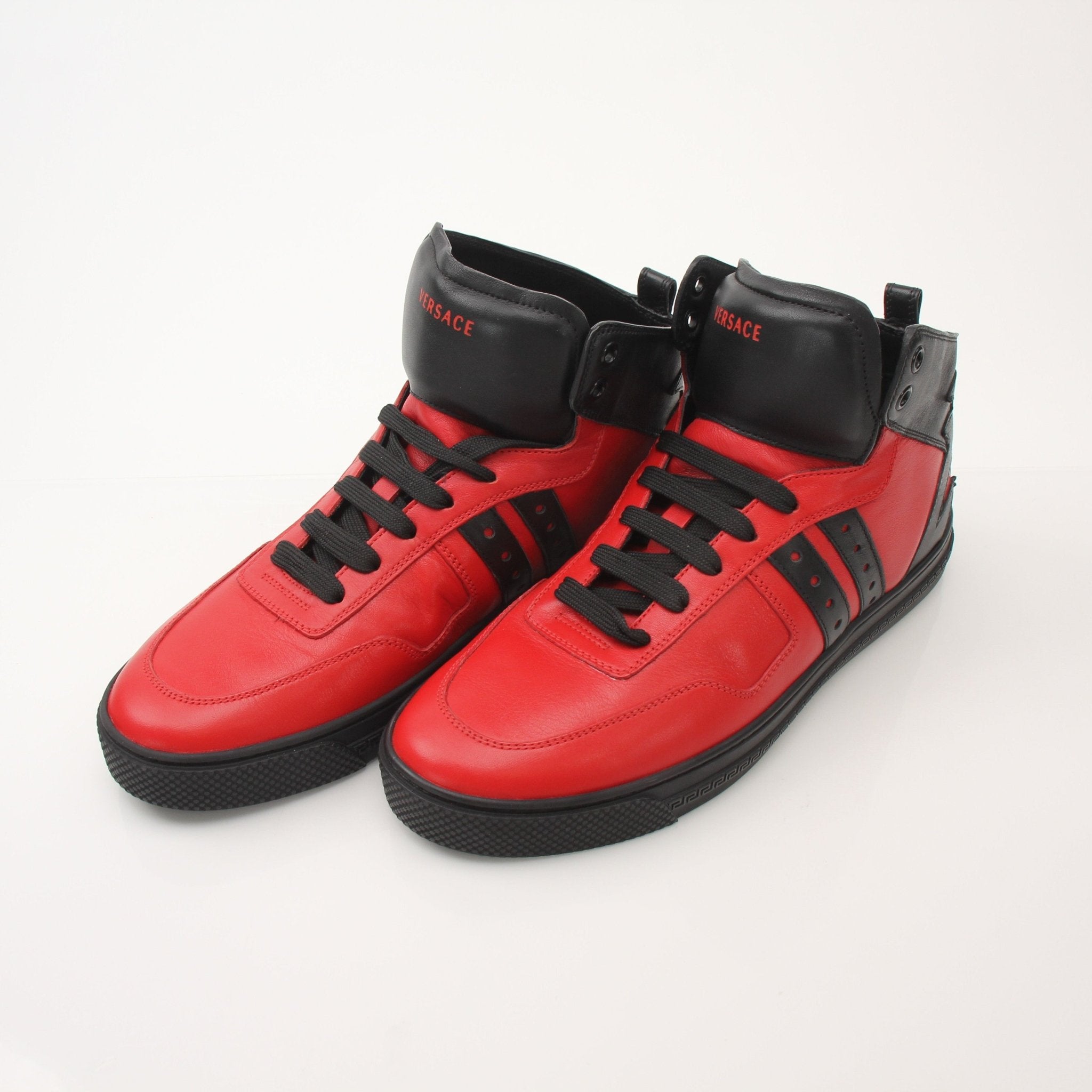 Red Versace men's mid-top sneakers featuring gold accents, stylish shoes with laces and a sleek design by Gold & Beyond.