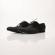 Louis Vuitton men's textured fabric derby shoes with sleek design and leather soles, displayed on a neutral background.