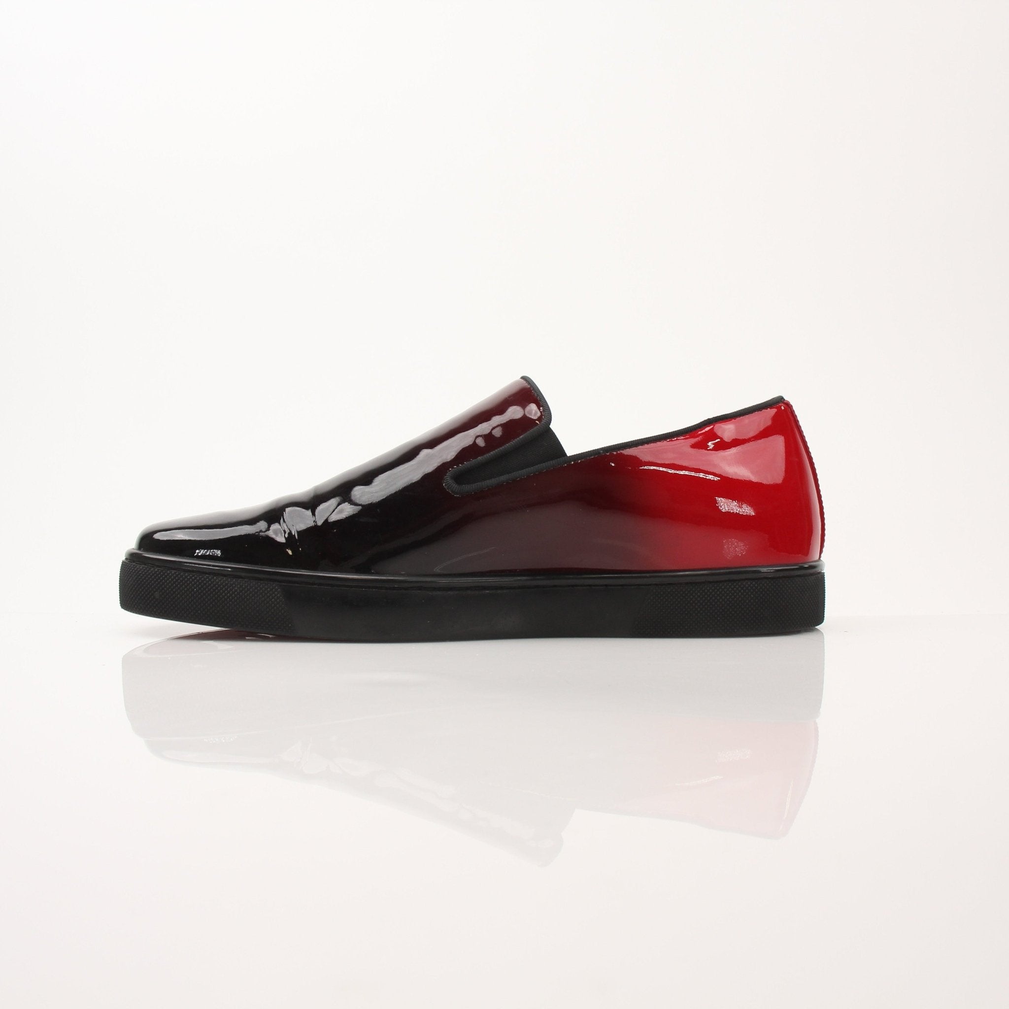 Christian Louboutin men's Pin Boat slip-on sneakers featuring sleek design and signature details, perfect for stylish casual wear.