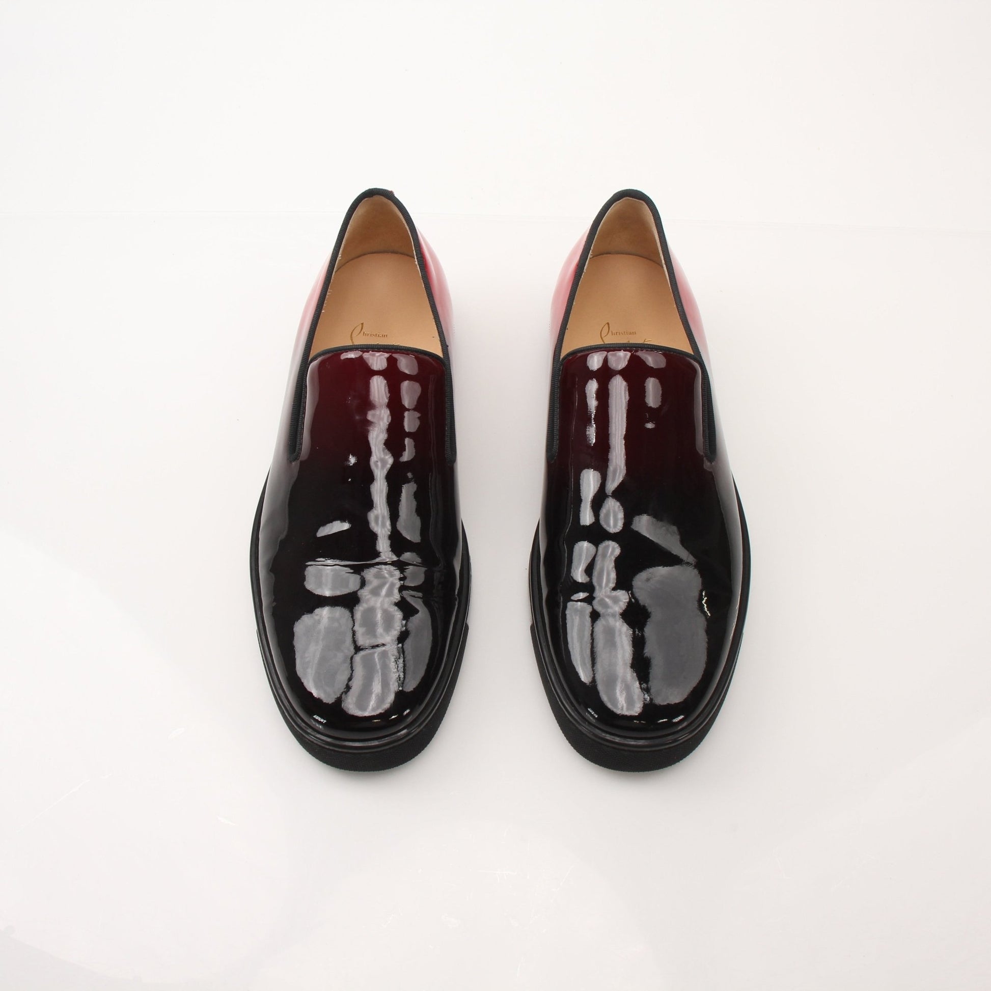 Christian Louboutin men's Pin Boat slip-on sneakers featuring sleek design and signature detailing, perfect for stylish casual wear.