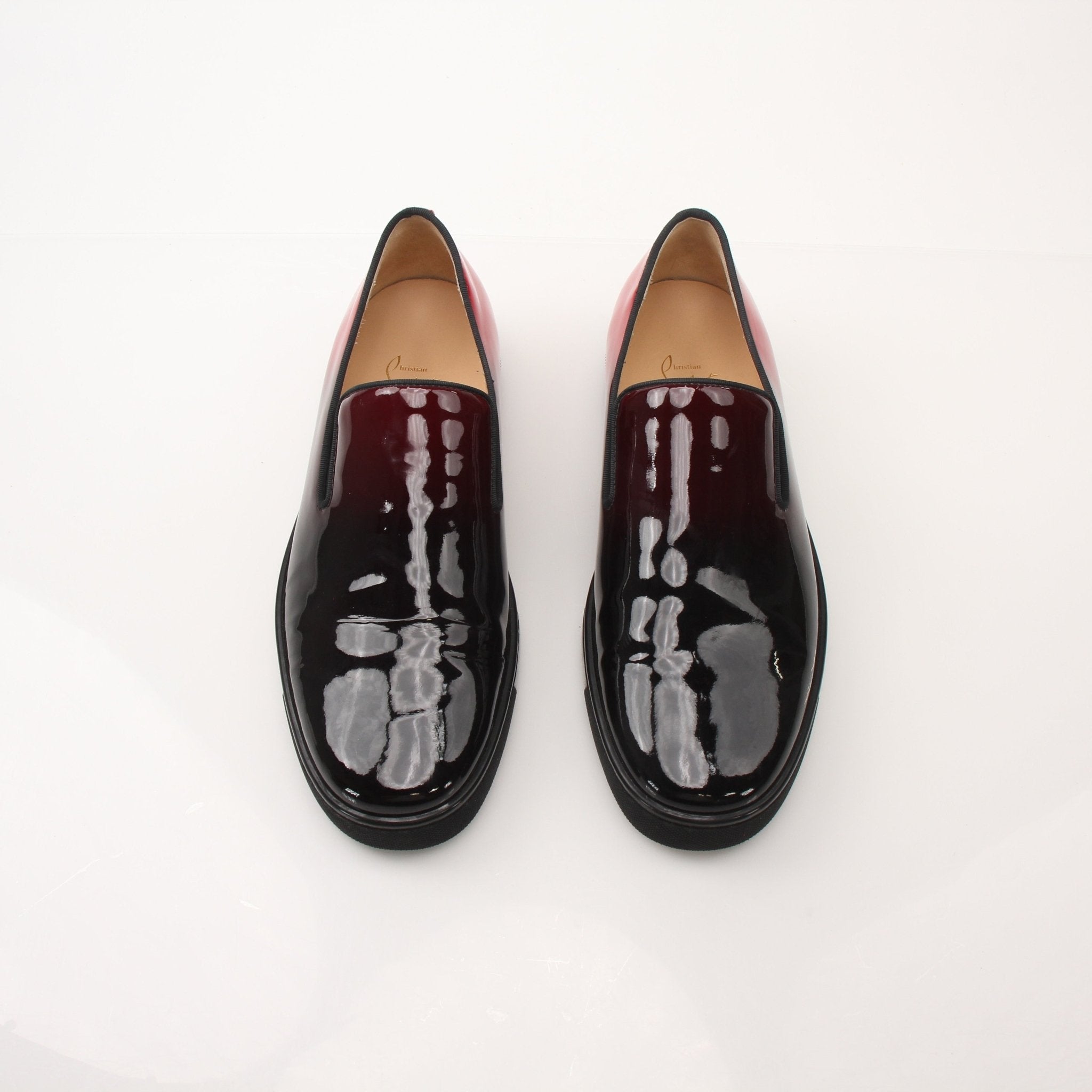 Christian Louboutin men's Pin Boat slip-on sneakers featuring sleek design and signature detailing, perfect for stylish casual wear.