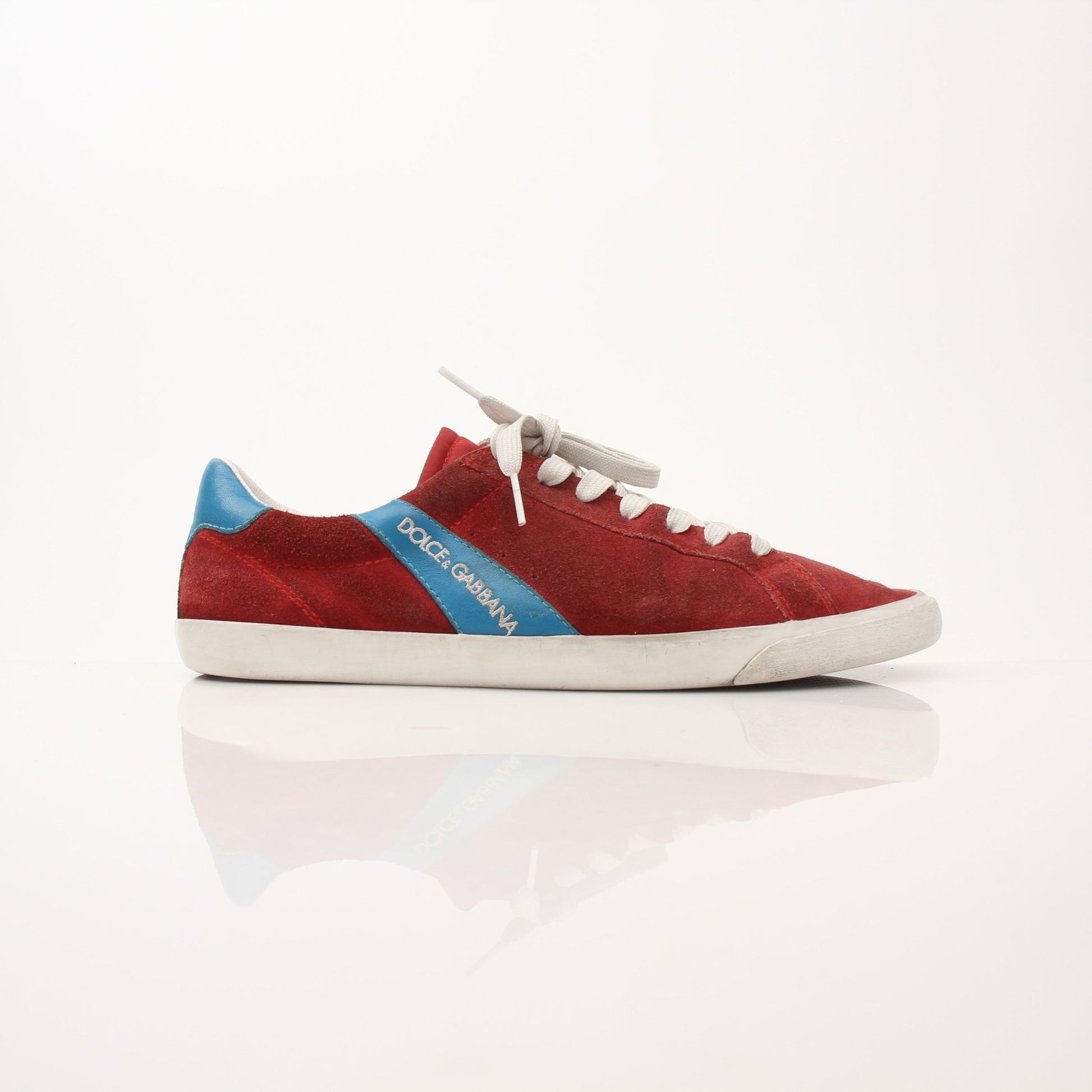 Gold & Beyond men's Dolce & Gabbana flat skating sneakers, stylish black shoes with white soles and logo details.