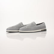 Gold & Beyond Prada Men’s Saint Tropez slip-on sneakers with sleek design and comfortable fit, shown in a close-up view.