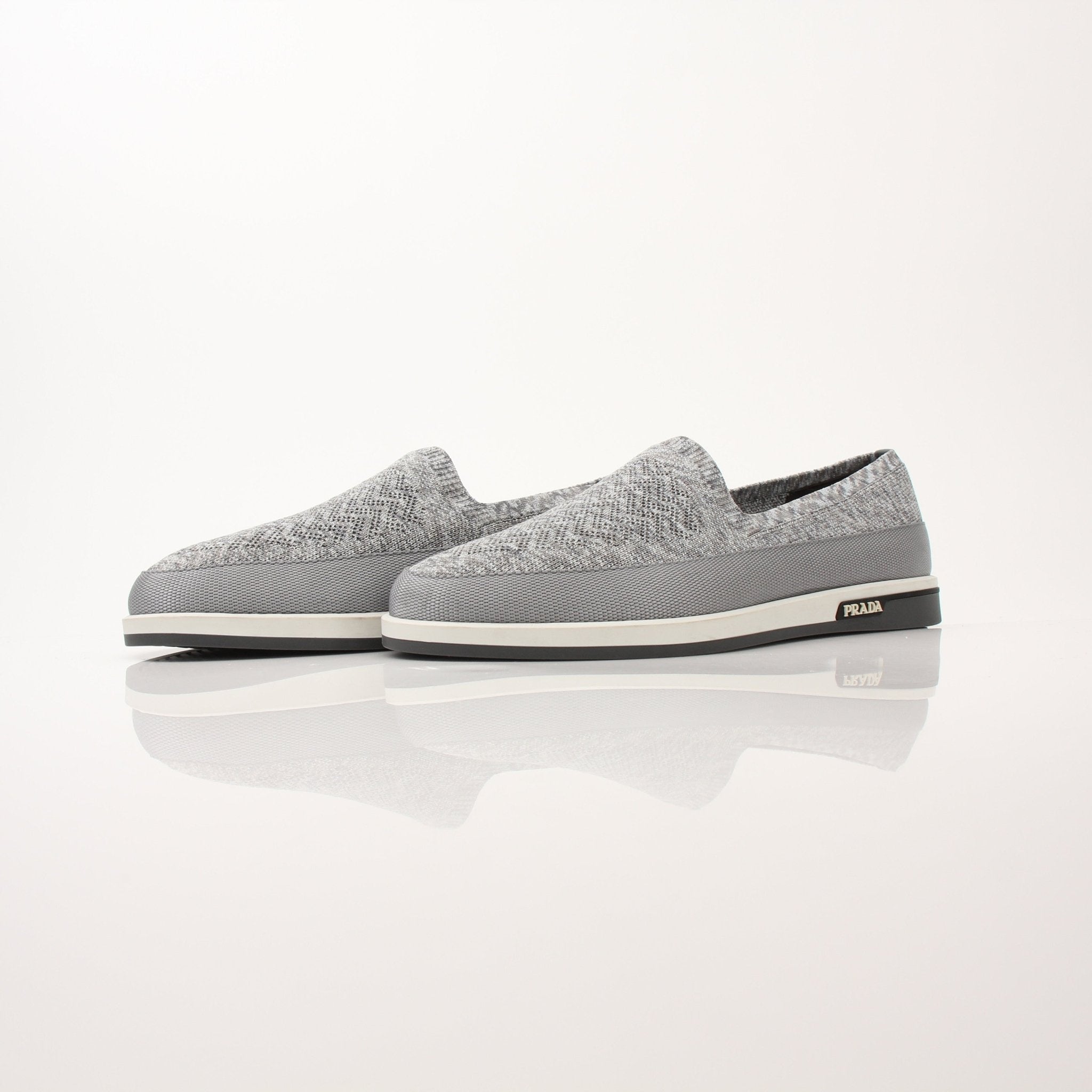 Gold & Beyond Prada Men’s Saint Tropez slip-on sneakers with sleek design and comfortable fit, shown in a close-up view.