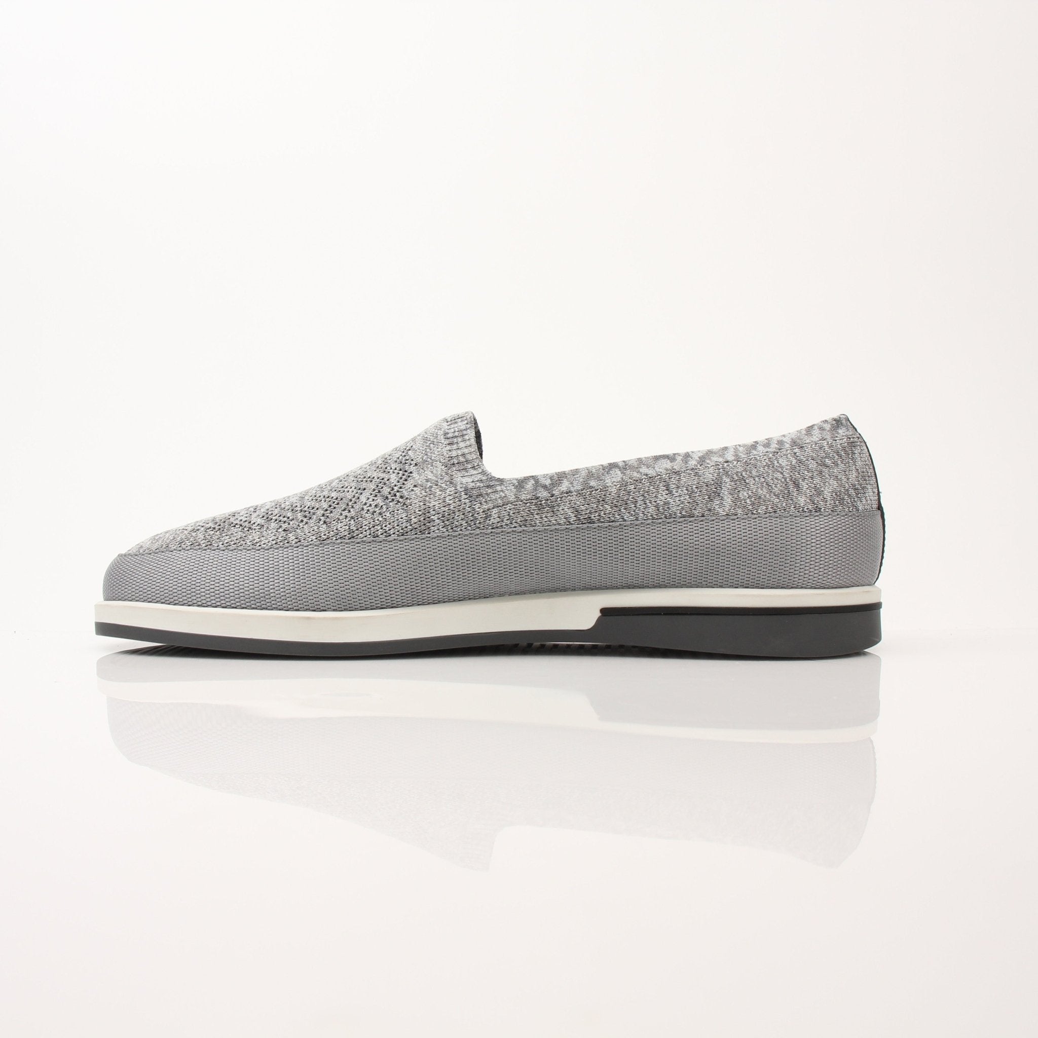 Gold & Beyond Prada Men’s Saint Tropez slip-on sneakers, stylish shoes with sleek design and comfortable fit, shown in the image.