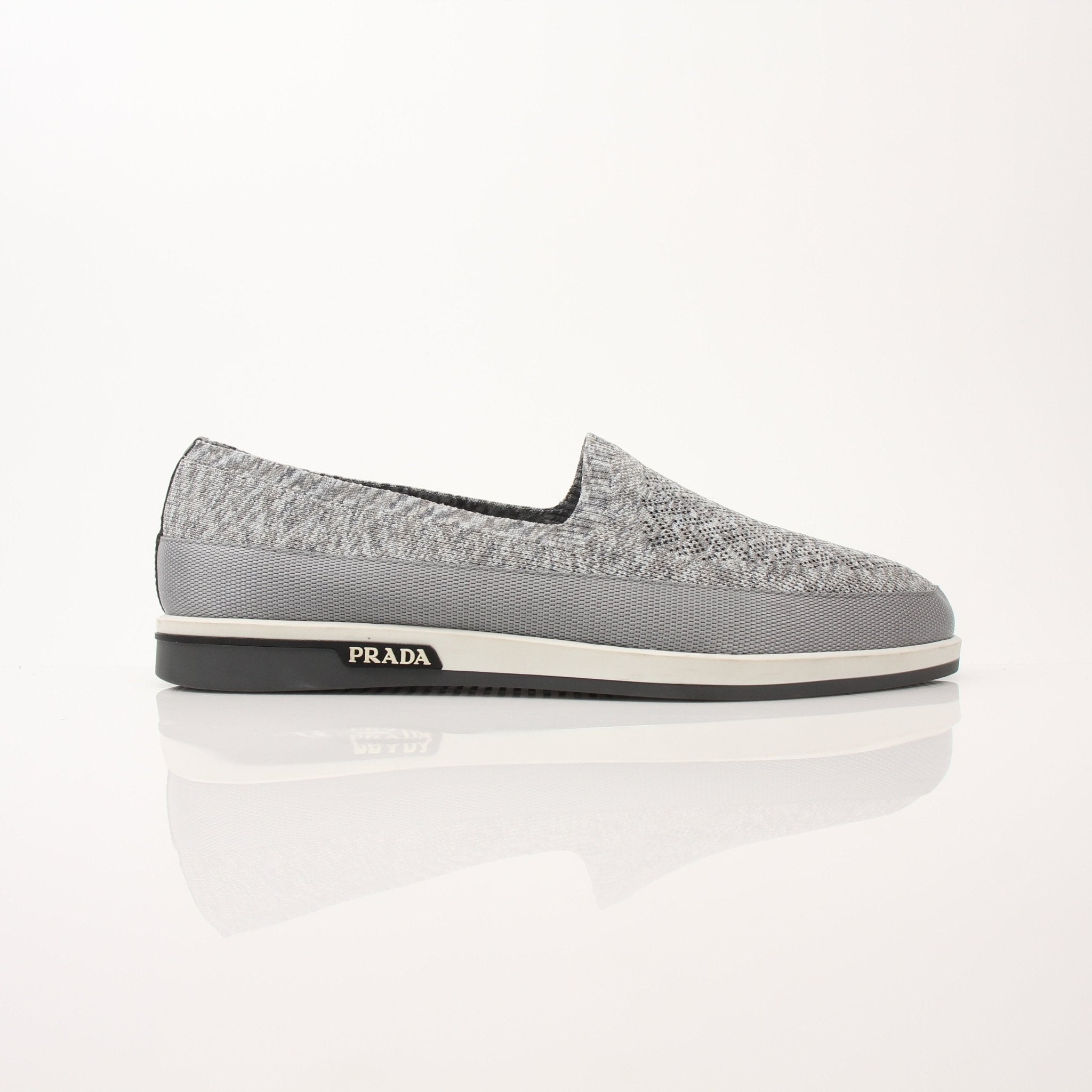 Gold & Beyond Prada Men’s Saint Tropez slip-on sneakers, stylish casual shoes with sleek design and comfortable fit.