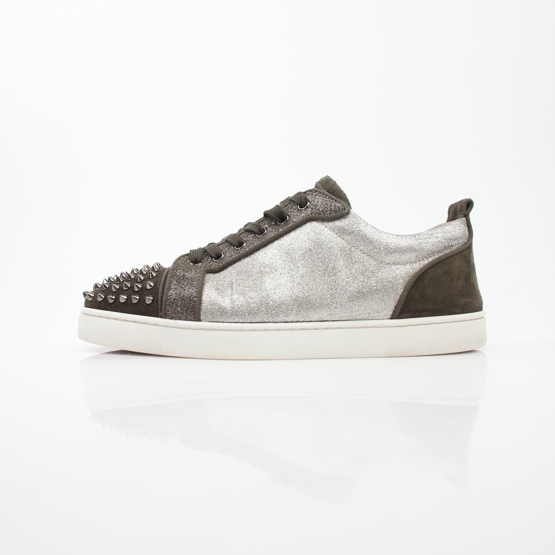 Christian Louboutin Silver Louis Junior Spikes Orlato sneakers, stylish shoes with metallic finish and spike details, designed for bold fashion.