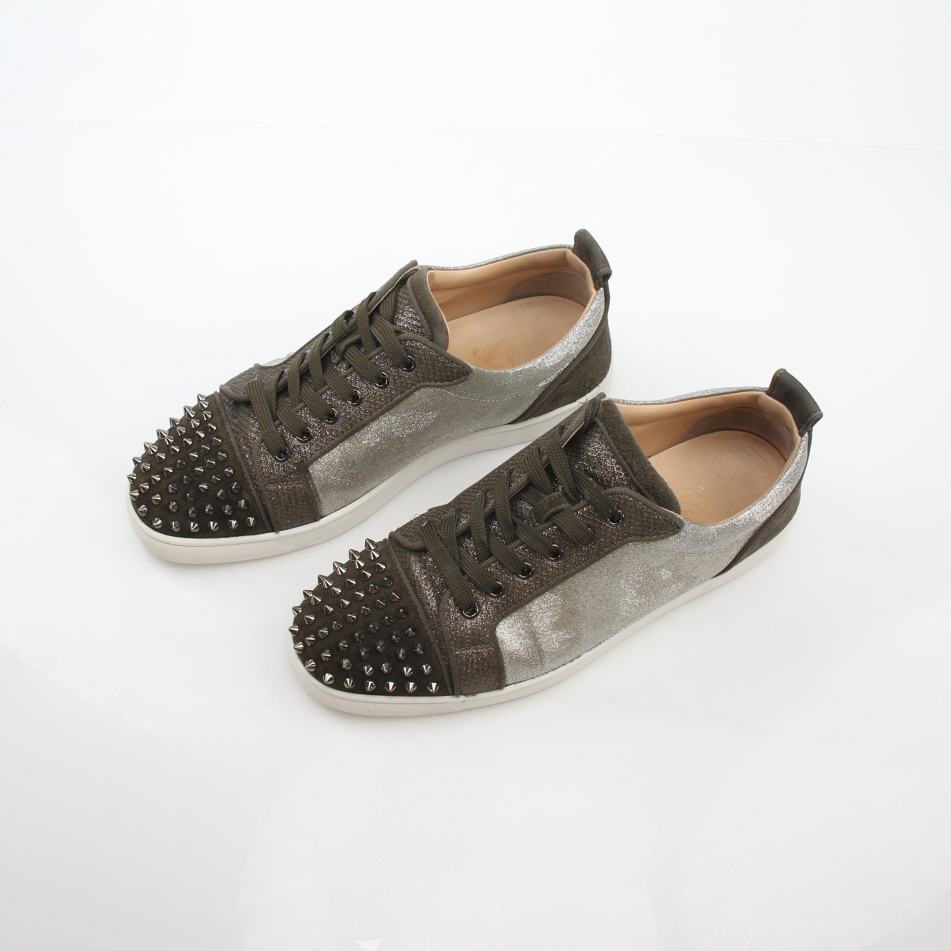 Christian Louboutin Silver Louis Junior Spikes Orlato sneakers, stylish shoes with spike accents, showcased in a clear product image.