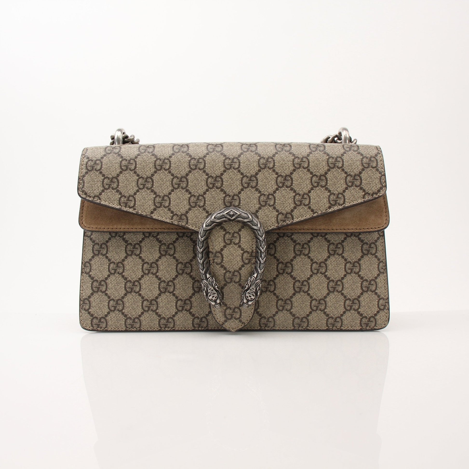Gold & Beyond Gucci Dionysus shoulder handbag with signature tiger head closure and chain strap, crafted from textured leather.