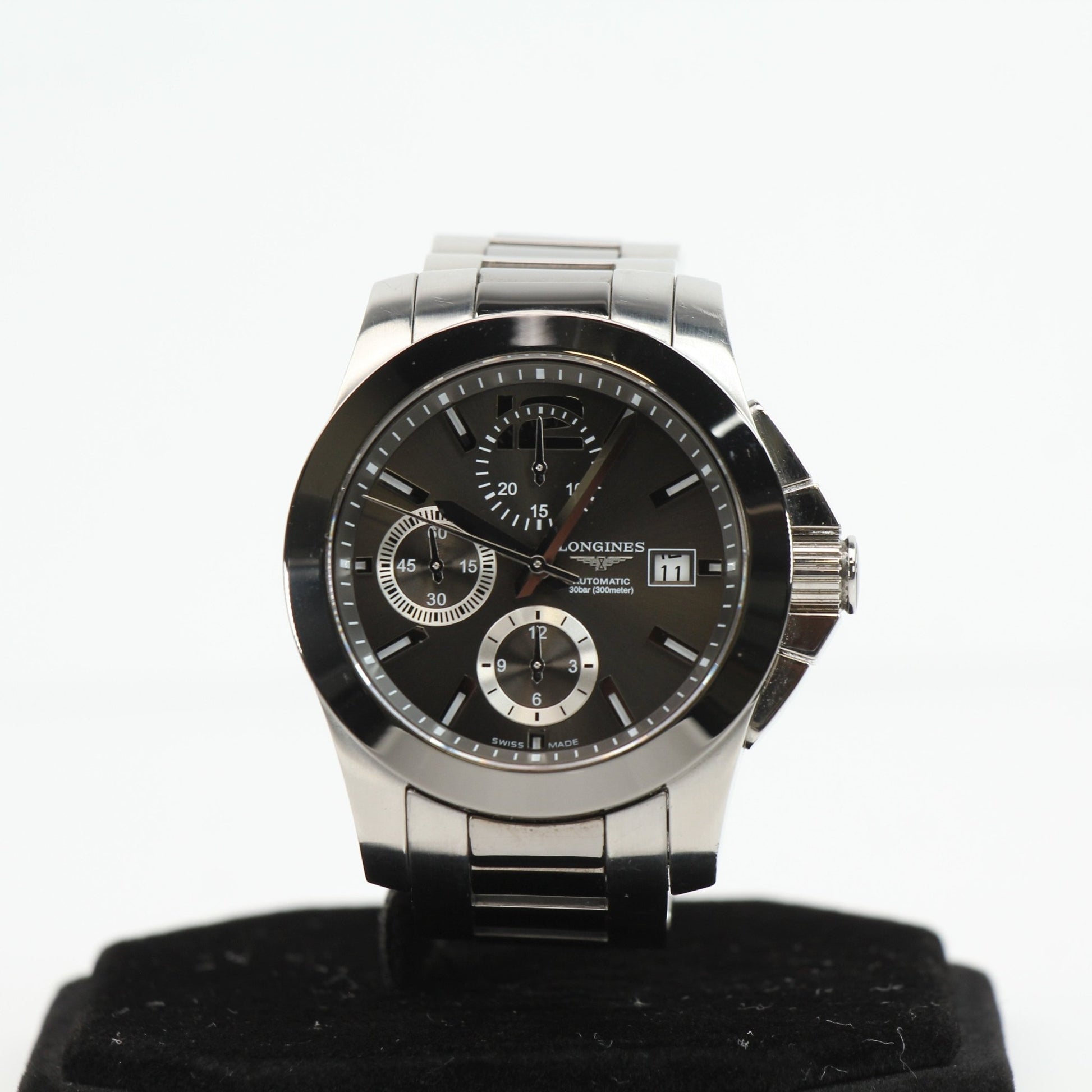 Gold & Beyond Longines automatic chronograph watch with stainless steel bracelet and black dial, showcasing elegant watch design.