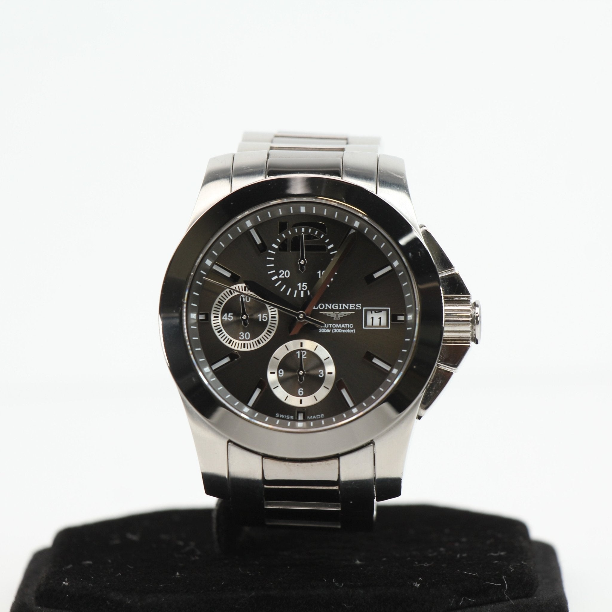 Gold & Beyond Longines automatic chronograph watch with stainless steel bracelet and black dial, showcasing elegant watch design.