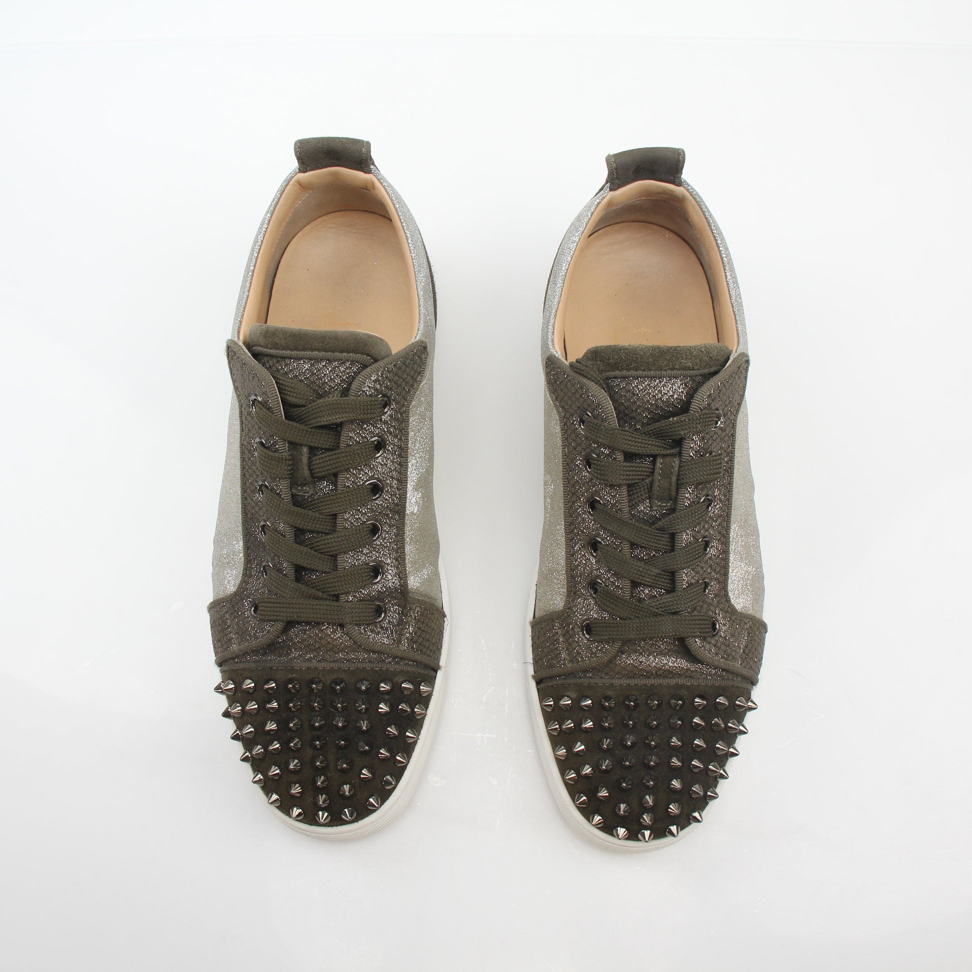 Christian Louboutin Silver Louis Junior Spikes Orlato sneakers with metallic finish and spike details, stylish shoes for men.