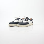 Christian Louboutin Navy and White Golfito Flat Sneakers, stylish shoes with navy and white design, on a clean background.