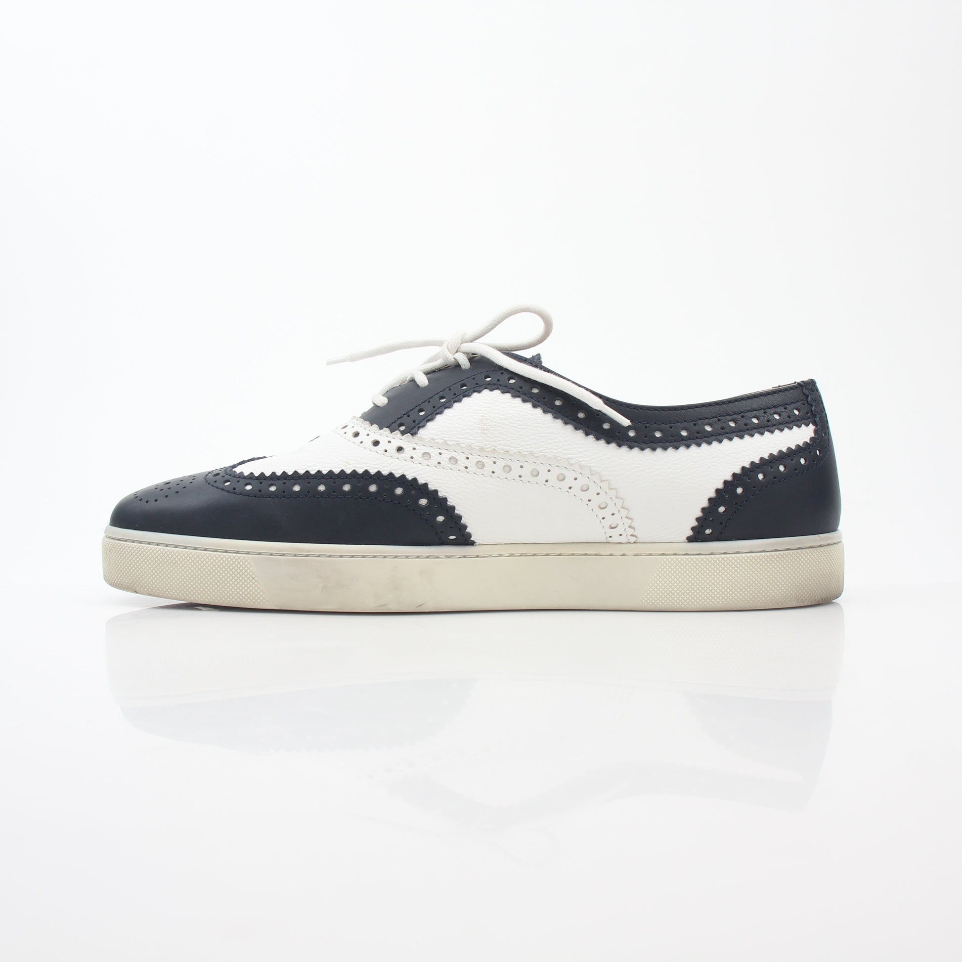 Christian Louboutin Navy and White Golfito Flat Sneakers, stylish shoes with sleek design and signature red sole detail.