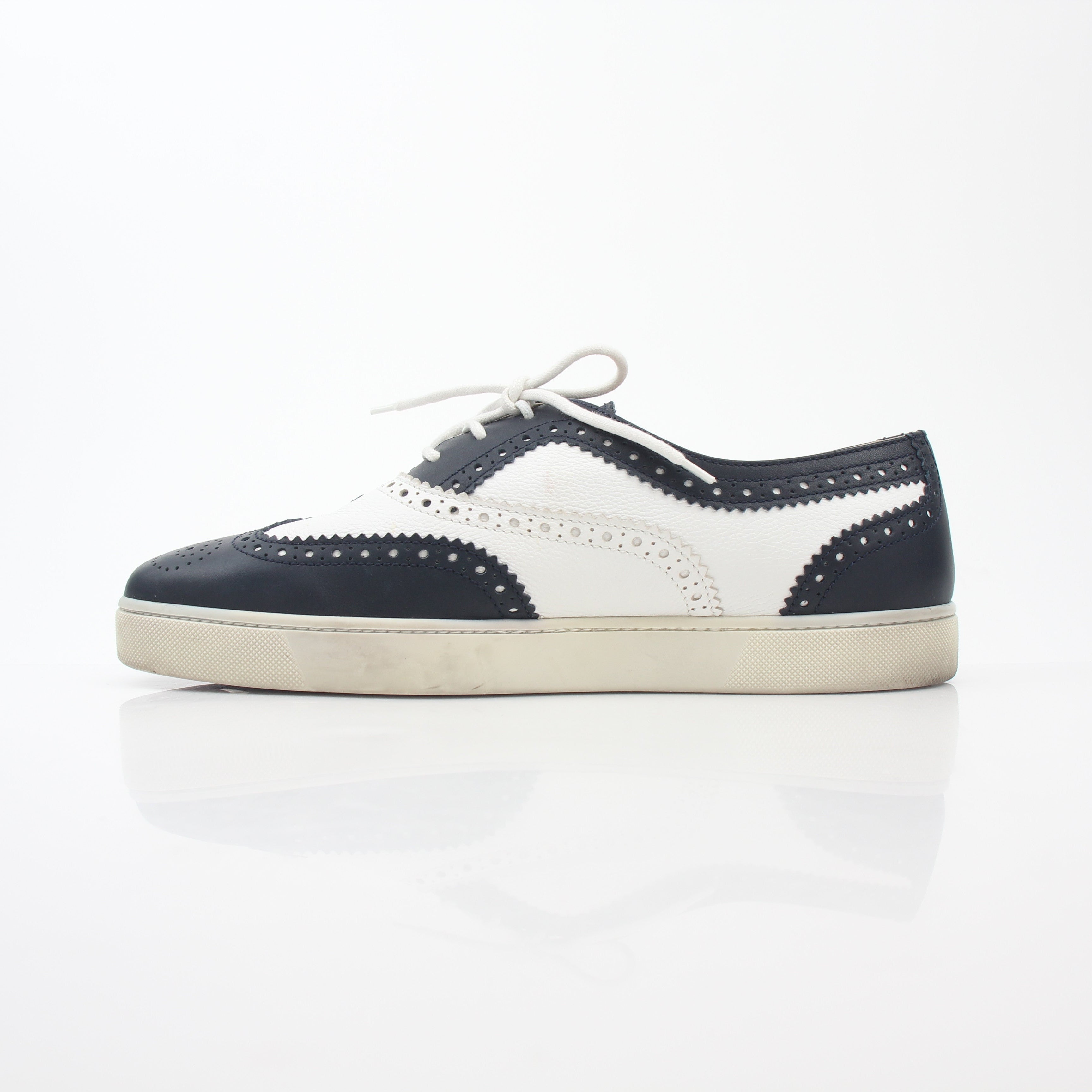 Christian Louboutin Navy and White Golfito Flat Sneakers, stylish shoes with sleek design and signature red sole detail.
