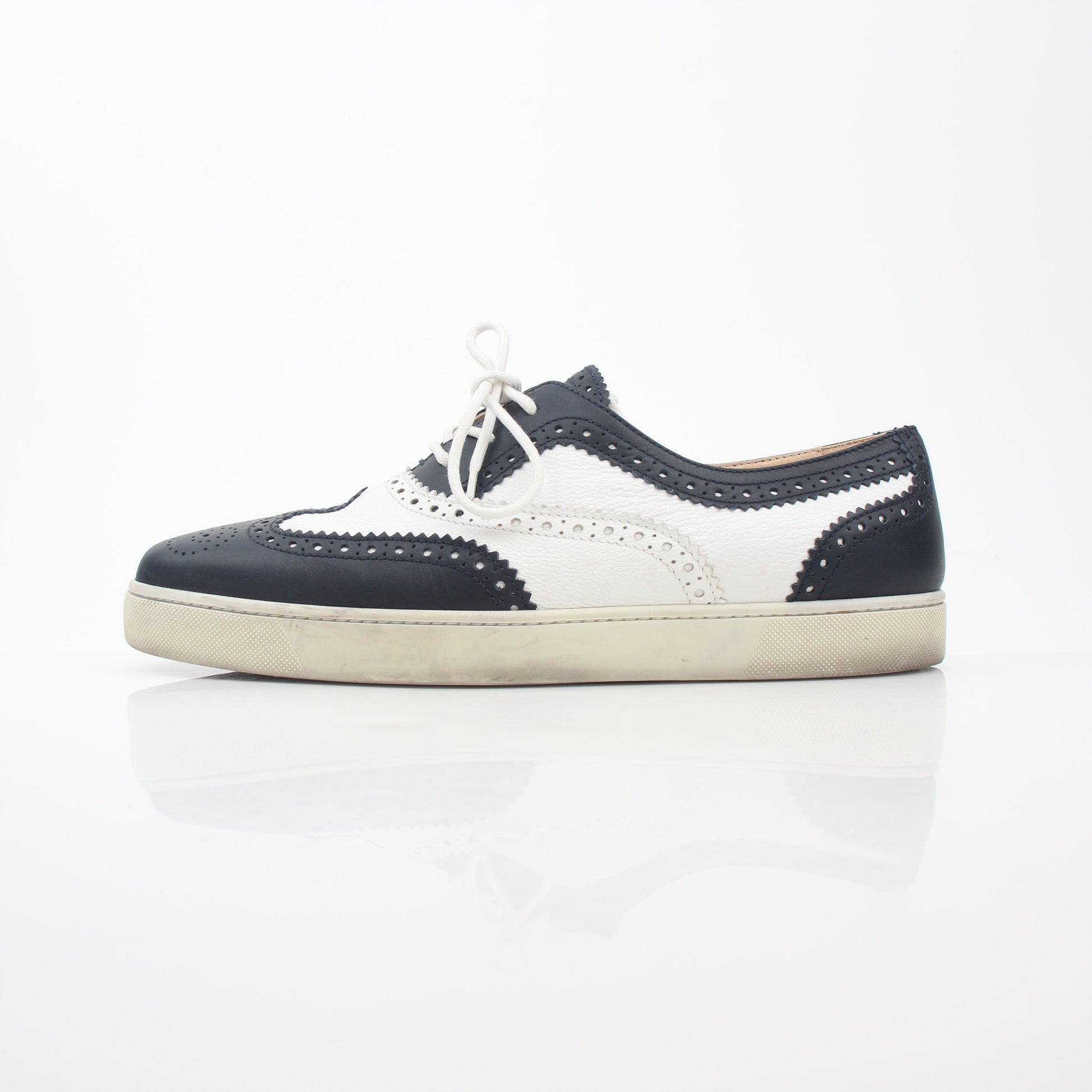 Christian Louboutin Navy and White Golfito Flat Sneakers, stylish shoes with navy and white color blocking, designed by Gold & Beyond.