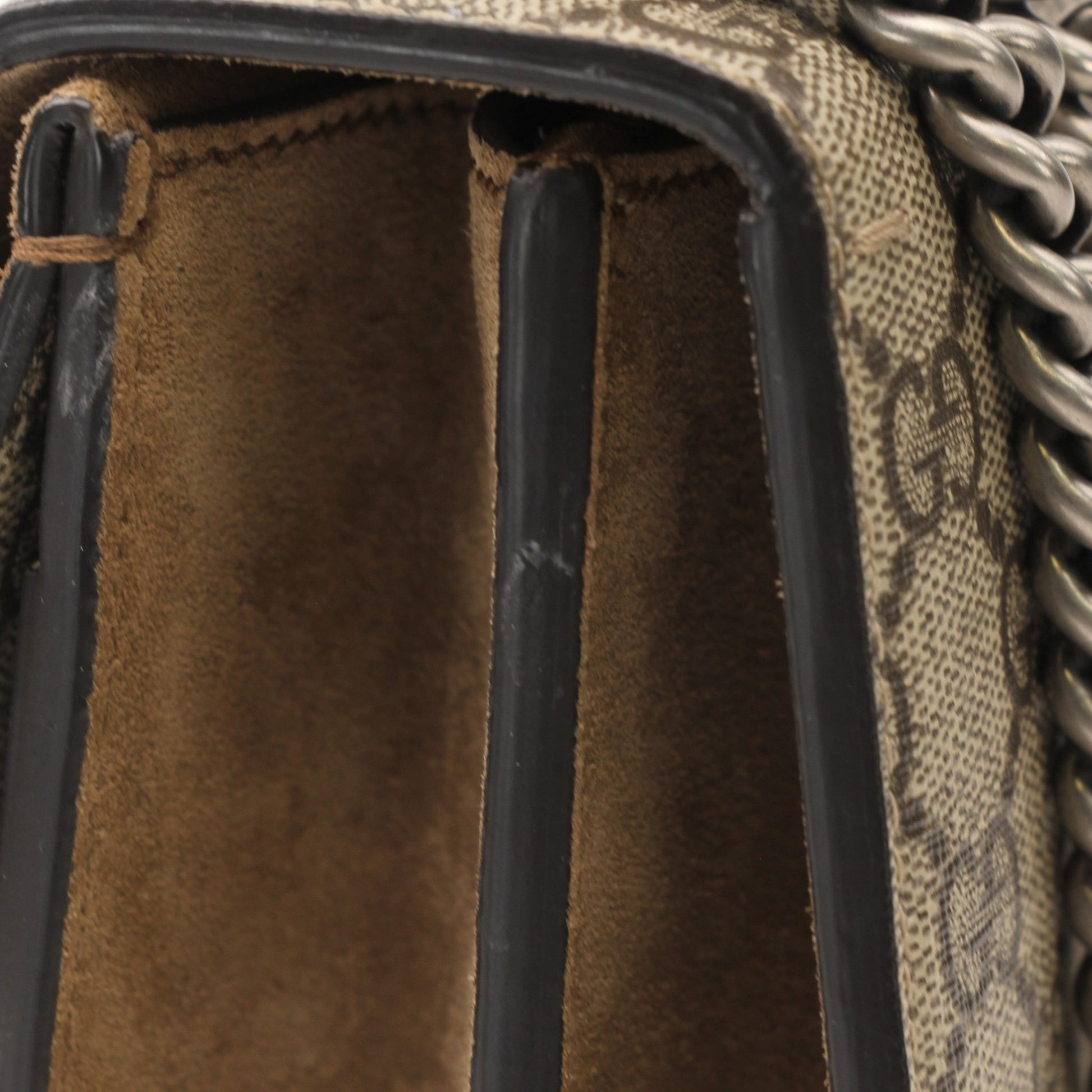 Gold & Beyond Gucci Dionysus shoulder handbag with textured leather, silver hardware, and signature tiger head clasp.