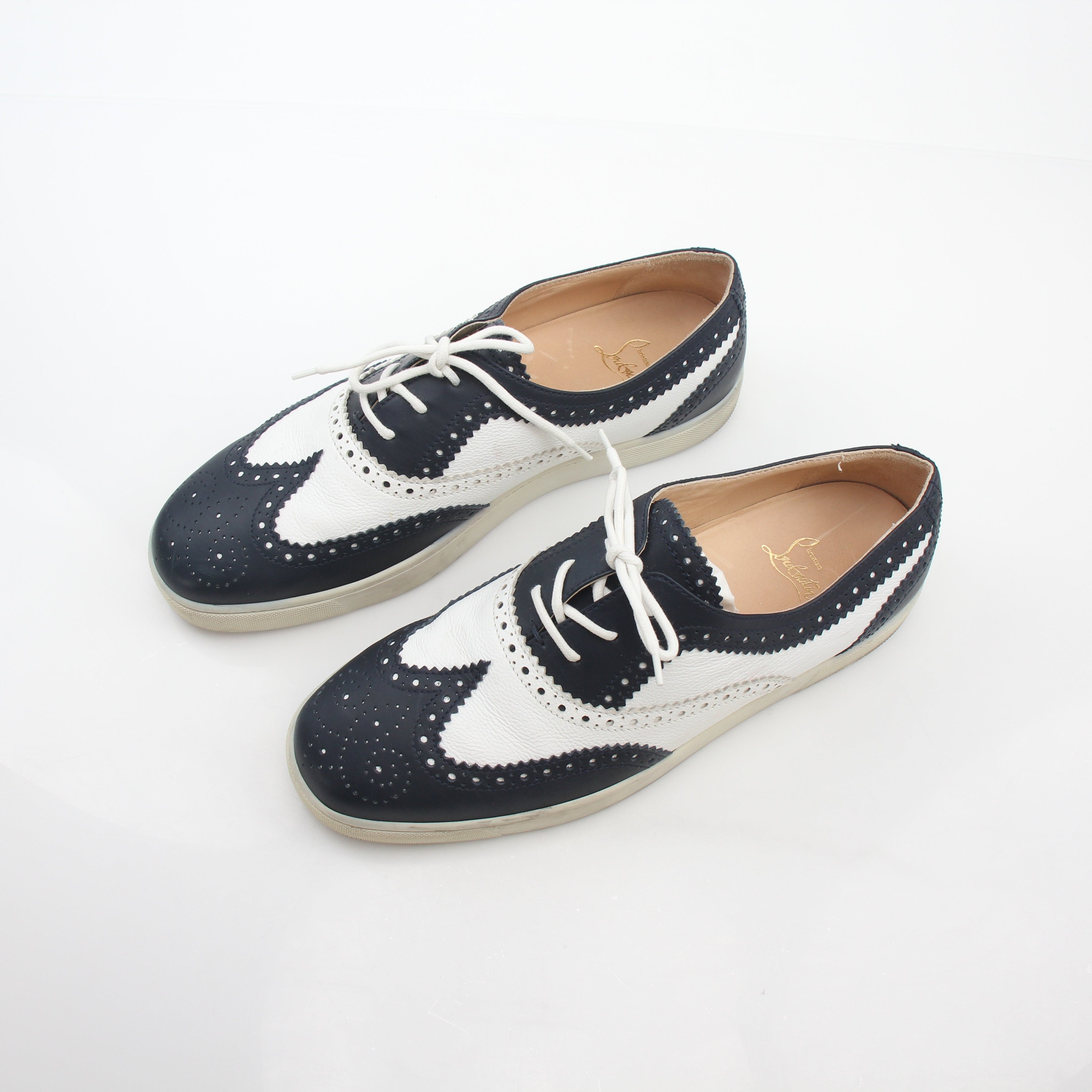 Christian Louboutin Navy and White Golfito flat sneakers with sleek design and contrasting colors, featuring signature branding.