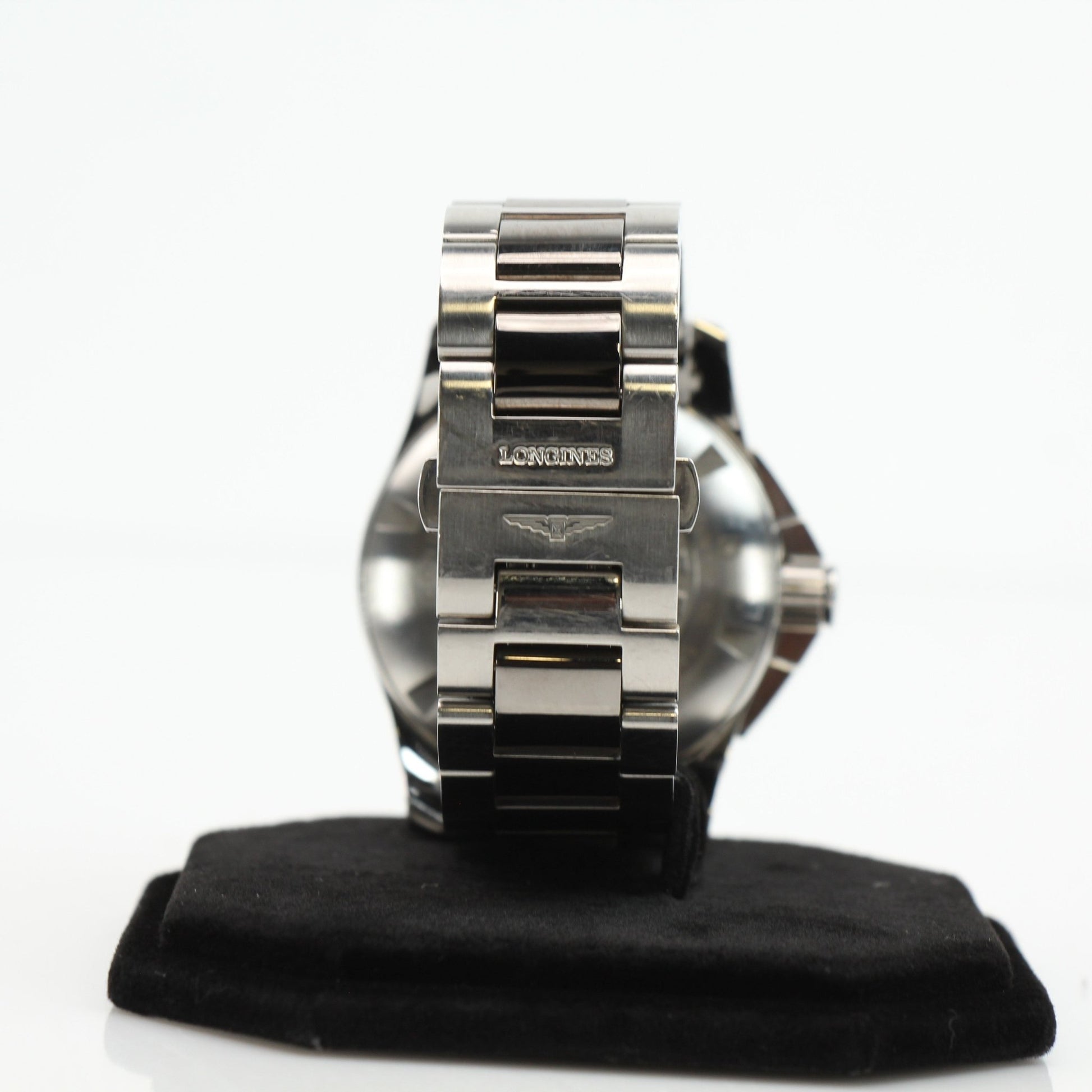 Gold & Beyond Longines automatic chronograph watch with stainless steel bracelet and black dial, featuring multiple subdials and date window.
