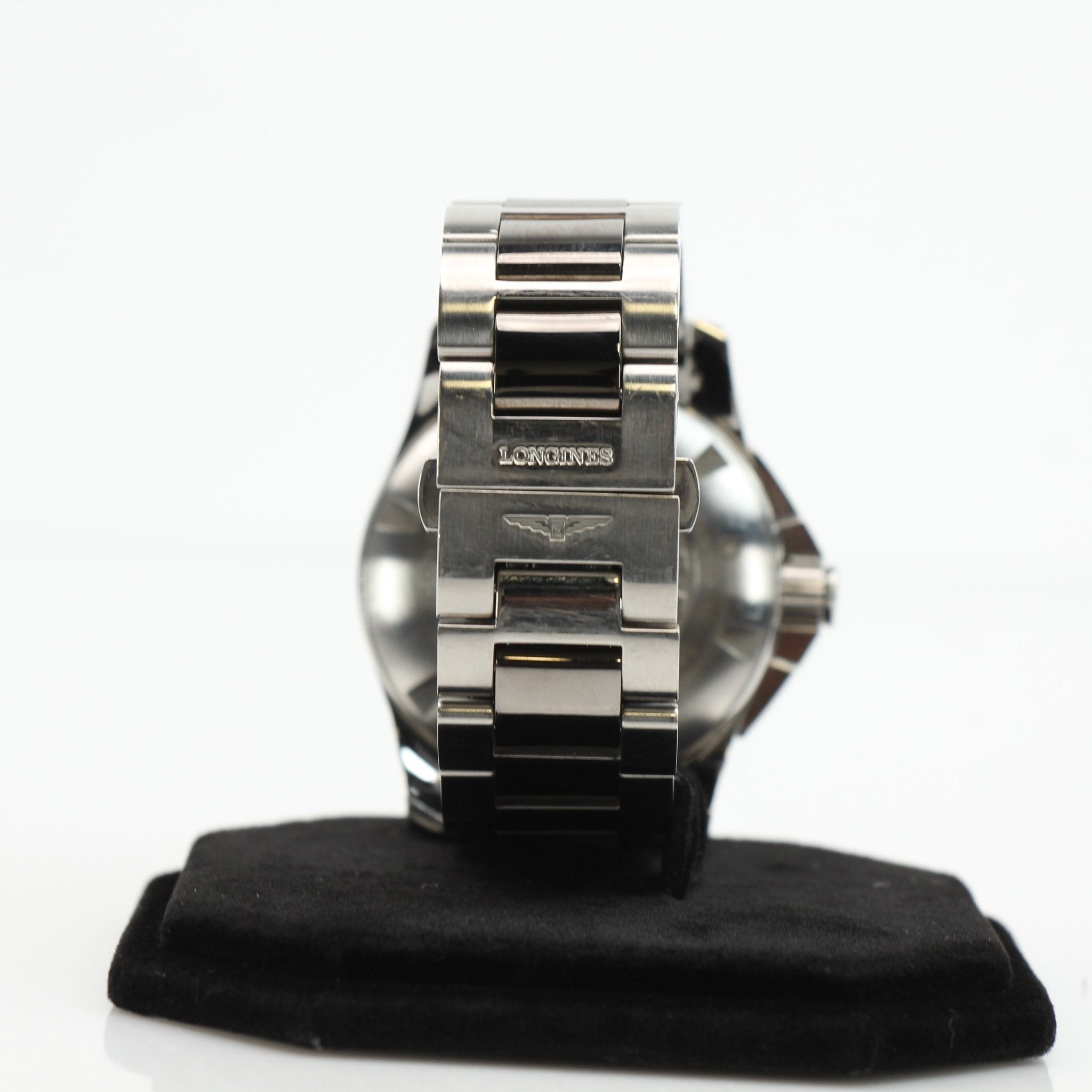 Gold & Beyond Longines automatic chronograph watch with stainless steel bracelet and black dial, featuring multiple subdials and date window.