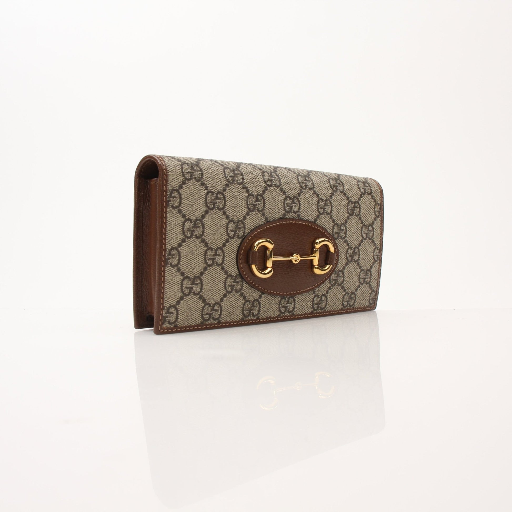 Gucci Azalea Horsebit Wallet on Chain handbag with floral design and gold chain strap, featuring Gucci logo and horsebit detail.