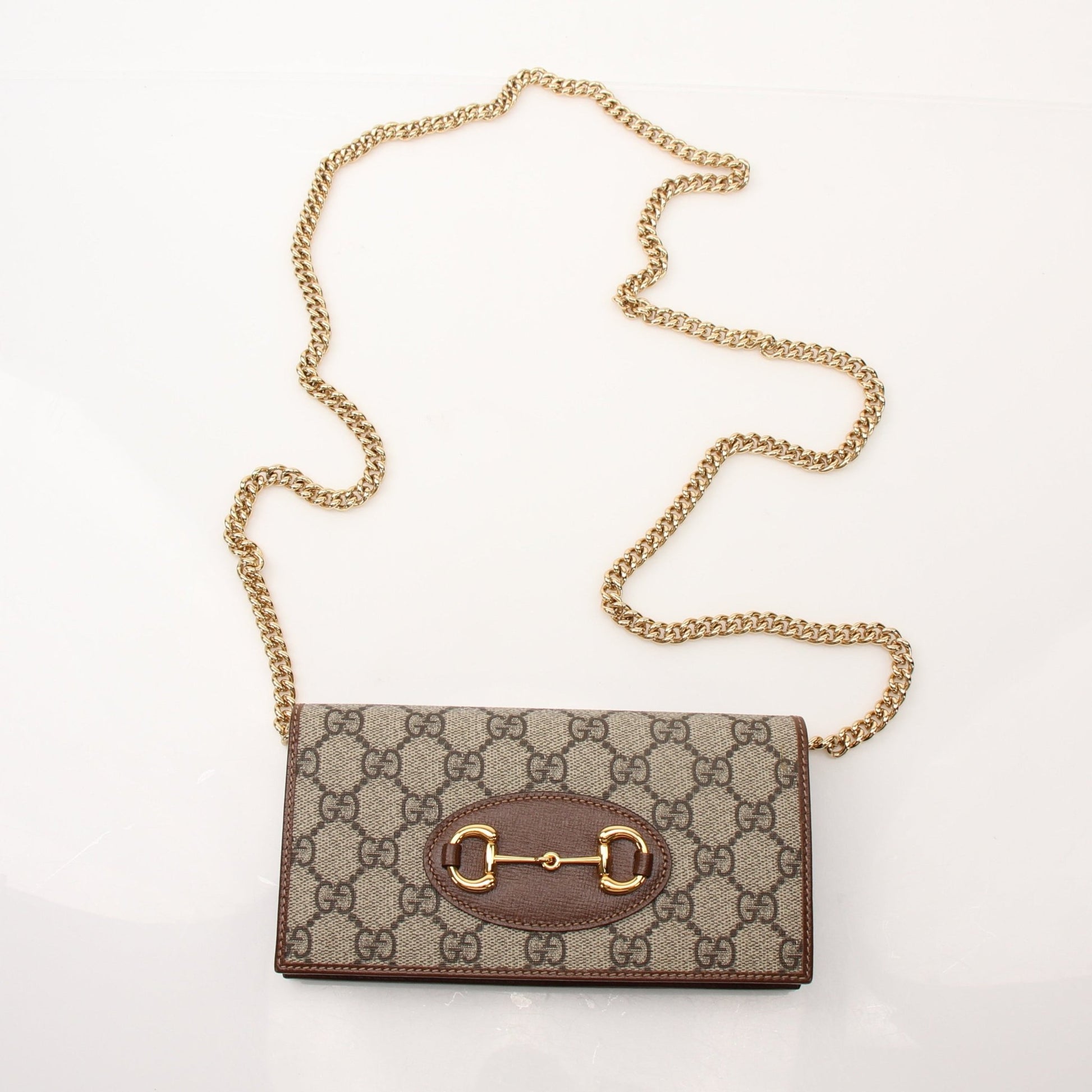 Gucci Azalea Horsebit Wallet on Chain handbag in pink leather with gold hardware and chain strap, featuring signature horsebit detail.