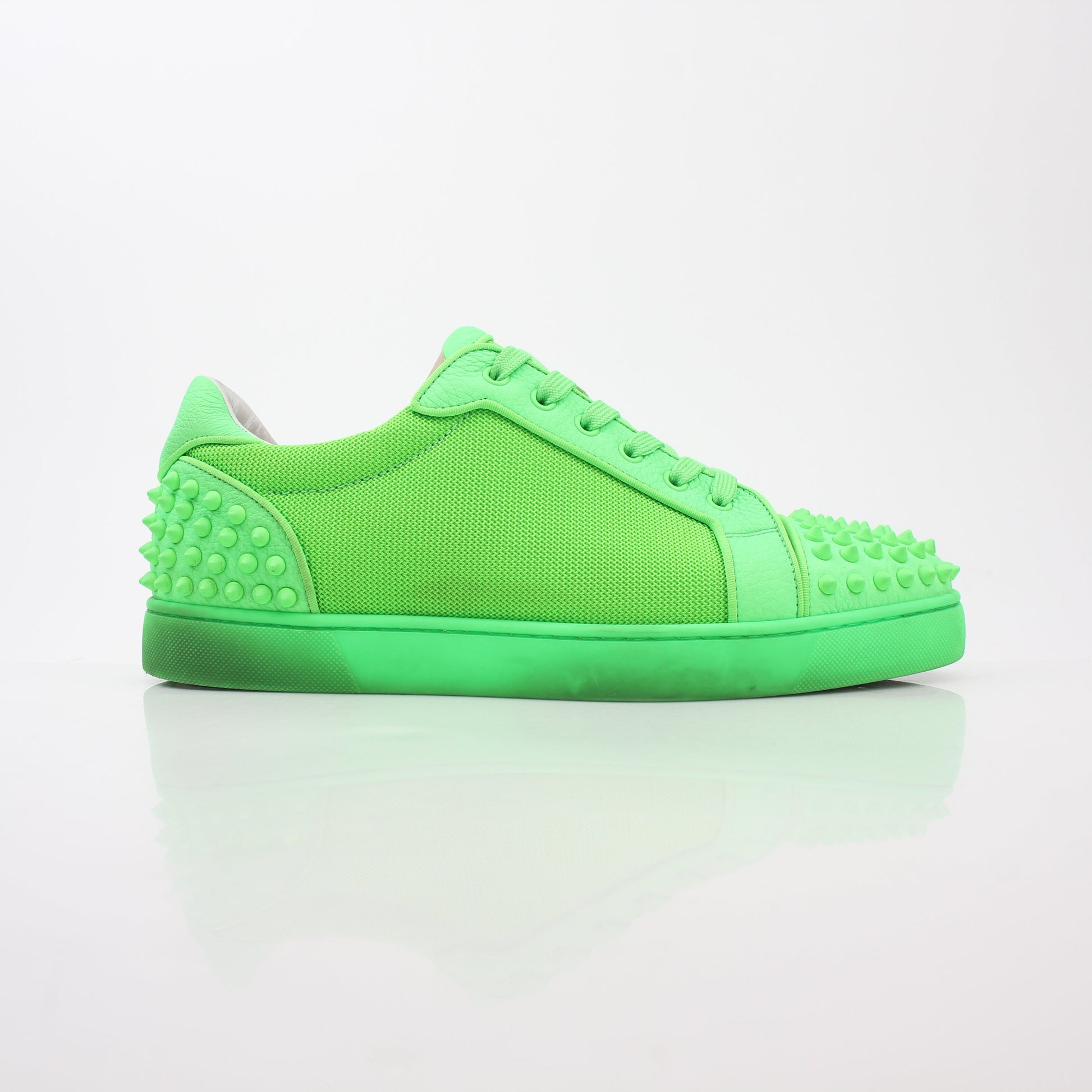Christian Louboutin Green Seavaste 2 Orlato sneakers, stylish shoes with vibrant green and sleek design, displayed on a white background.