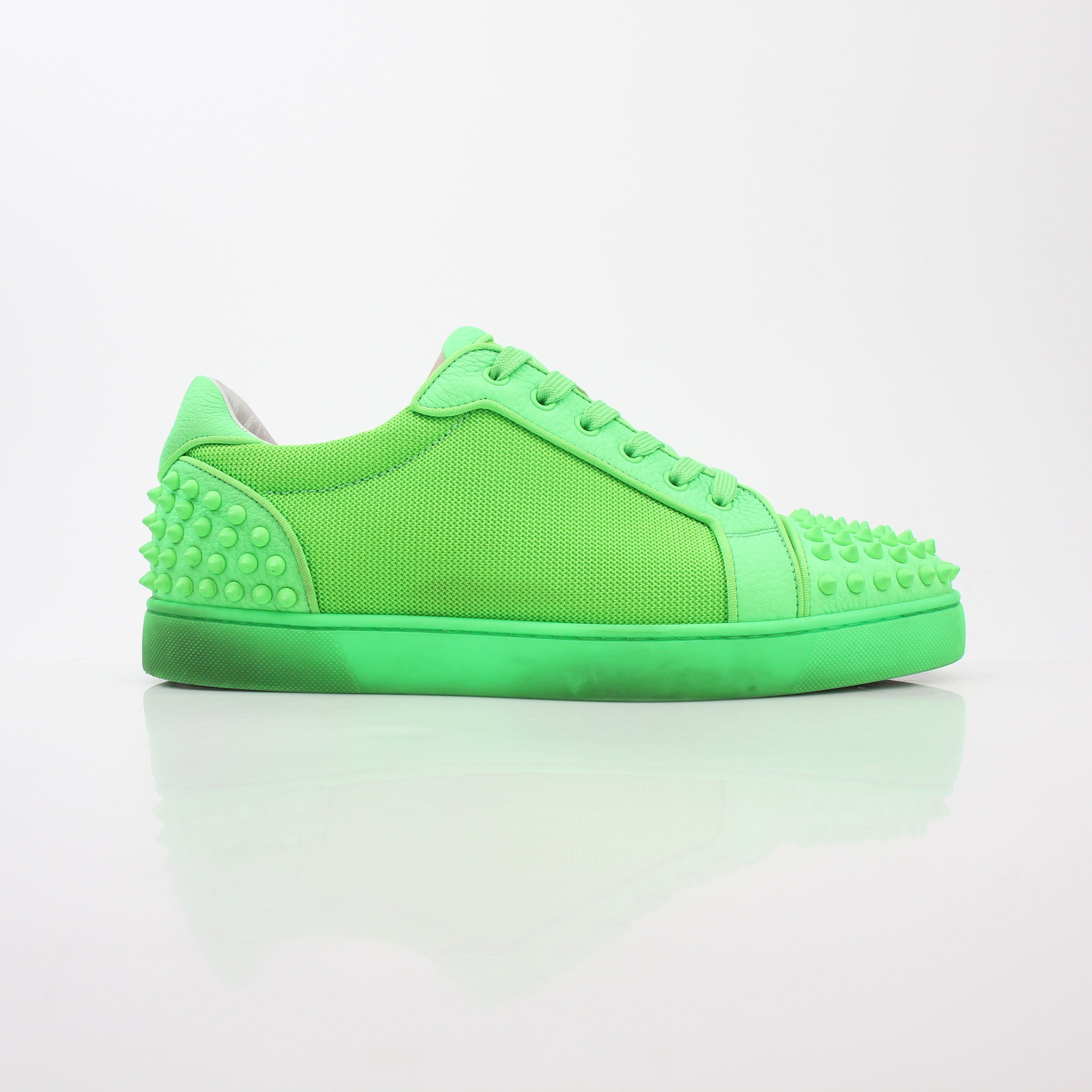 Christian Louboutin Green Seavaste 2 Orlato sneakers, stylish shoes with vibrant green and sleek design, displayed on a white background.