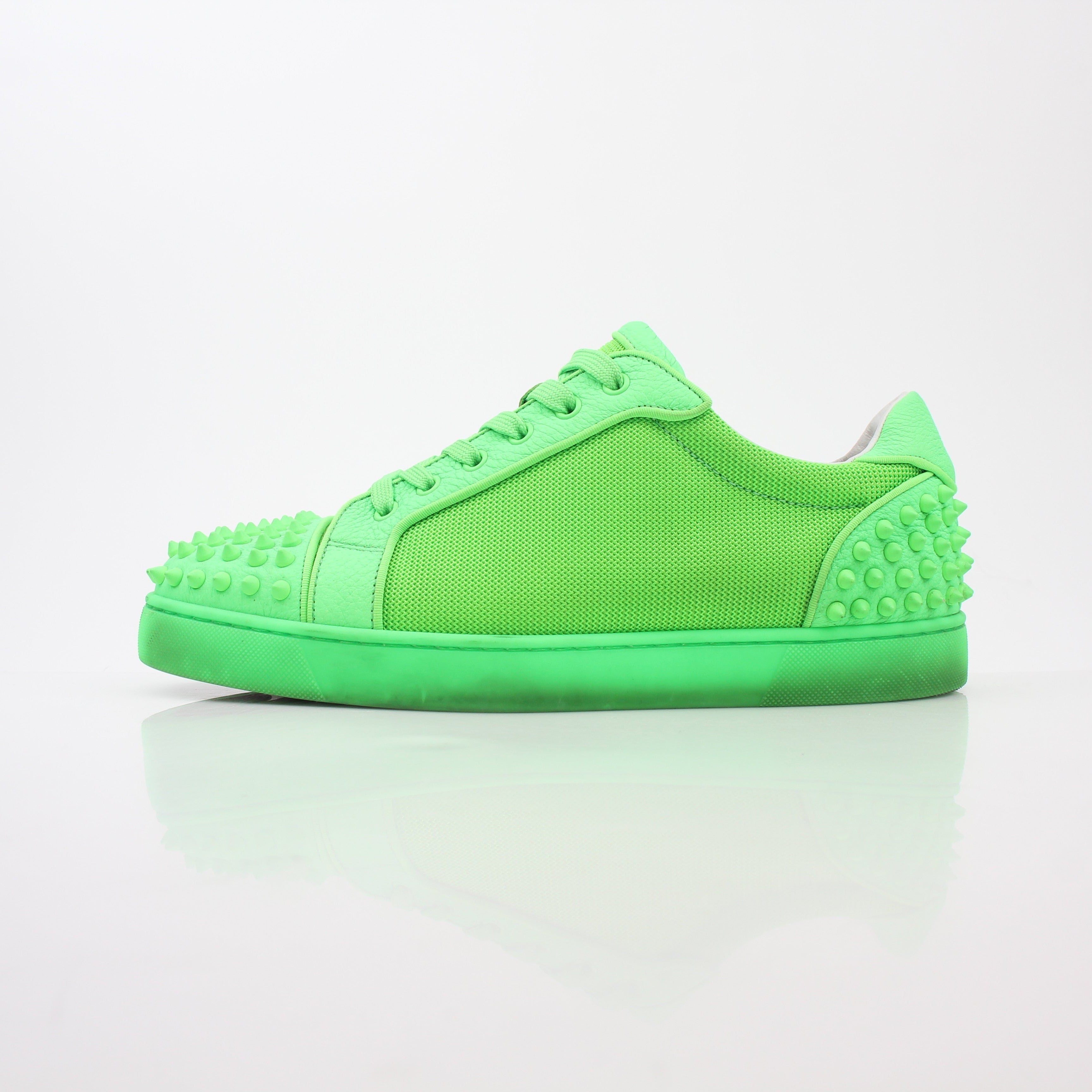Christian Louboutin Green Seavaste 2 Orlato sneakers featuring vibrant green color, stylish shoes with signature red soles.