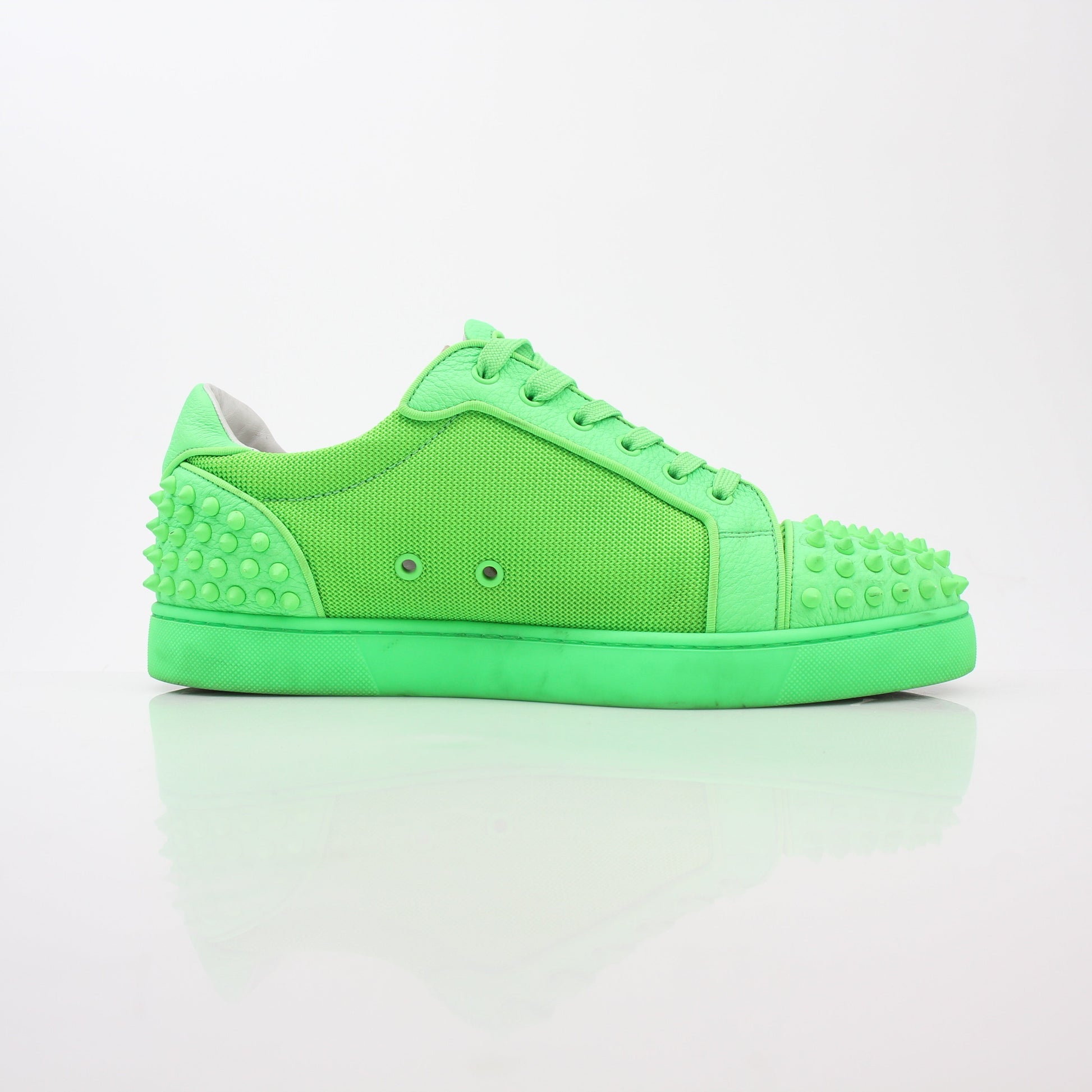 Christian Louboutin Green Seavaste 2 Orlato sneakers by Gold & Beyond, showcasing stylish green shoes with signature red soles.