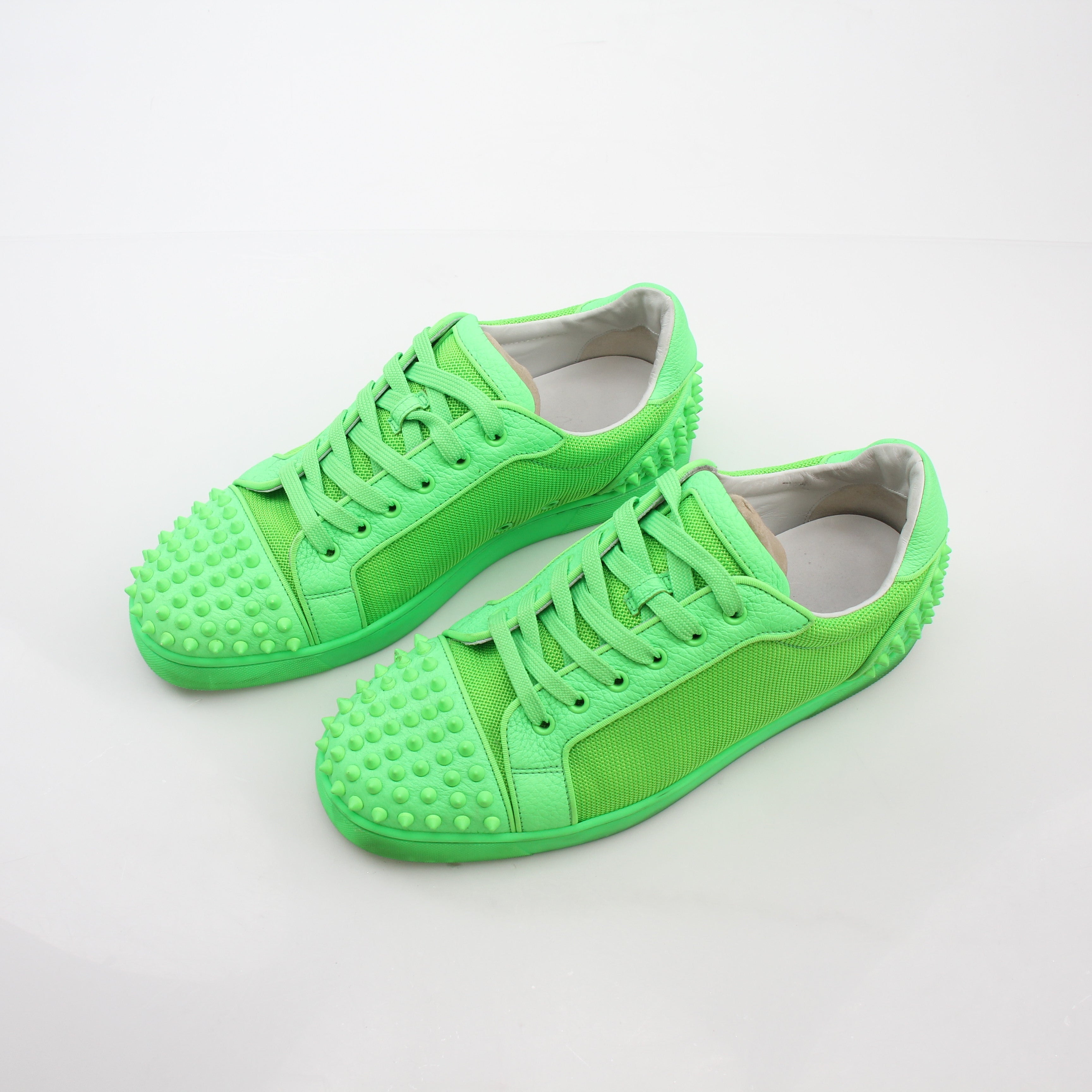 Christian Louboutin Green Seavaste 2 Orlato sneakers, stylish shoes with green accents and distinctive design, displayed on a white background.